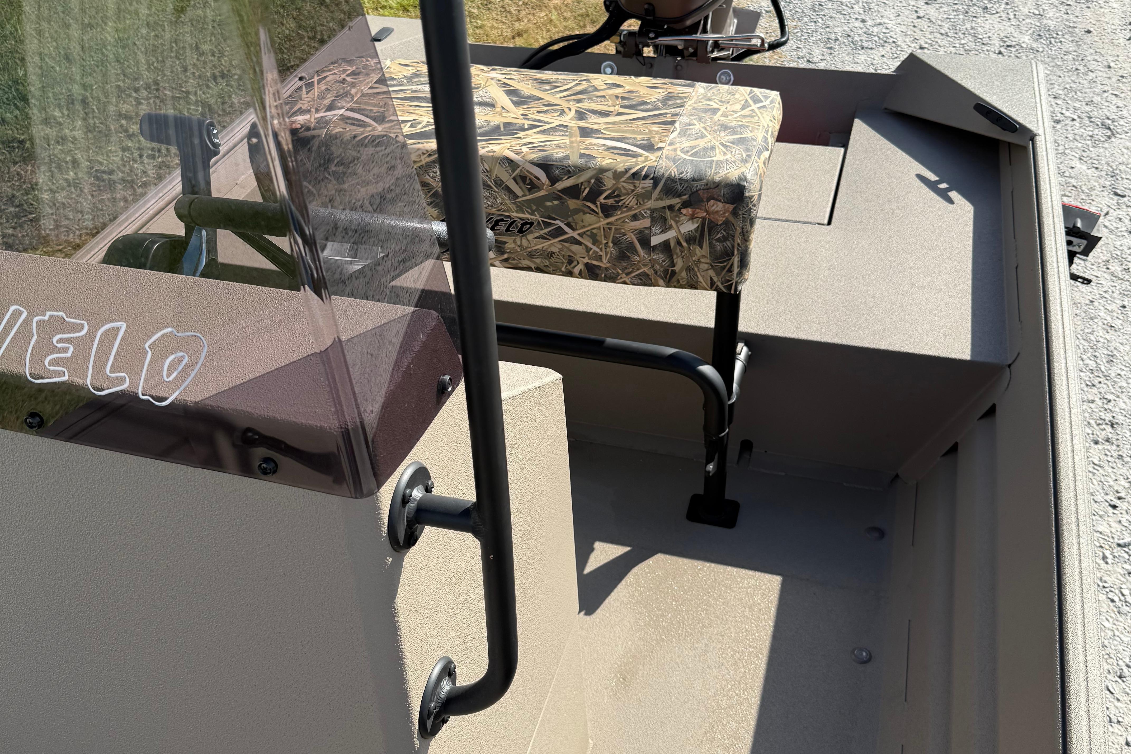 2025 Alweld 1756 V MARSH C.C. boat interior with camouflage seat and steering console.