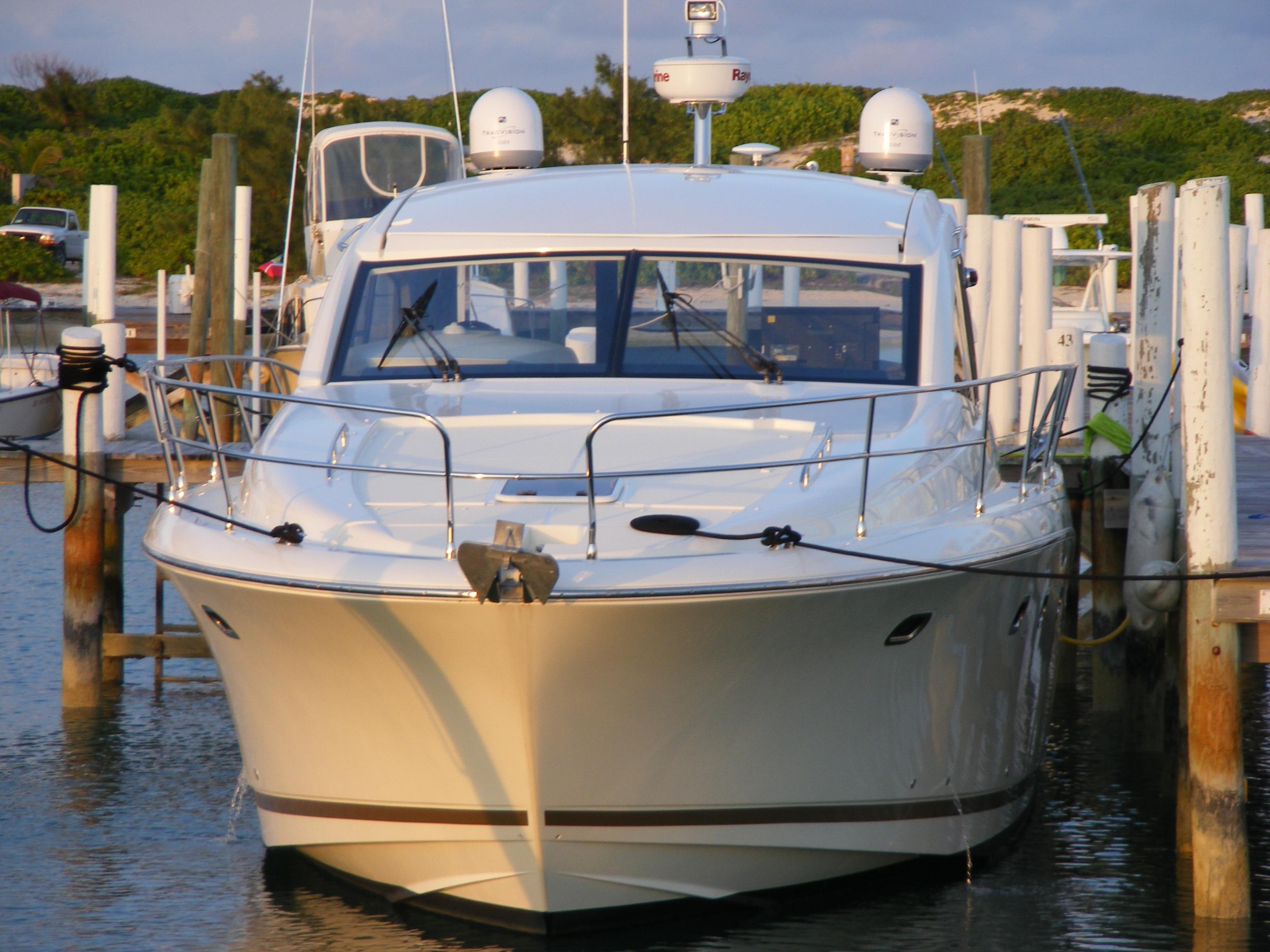 Front view of a 2012 Prestige 440S yacht docked at a marina.