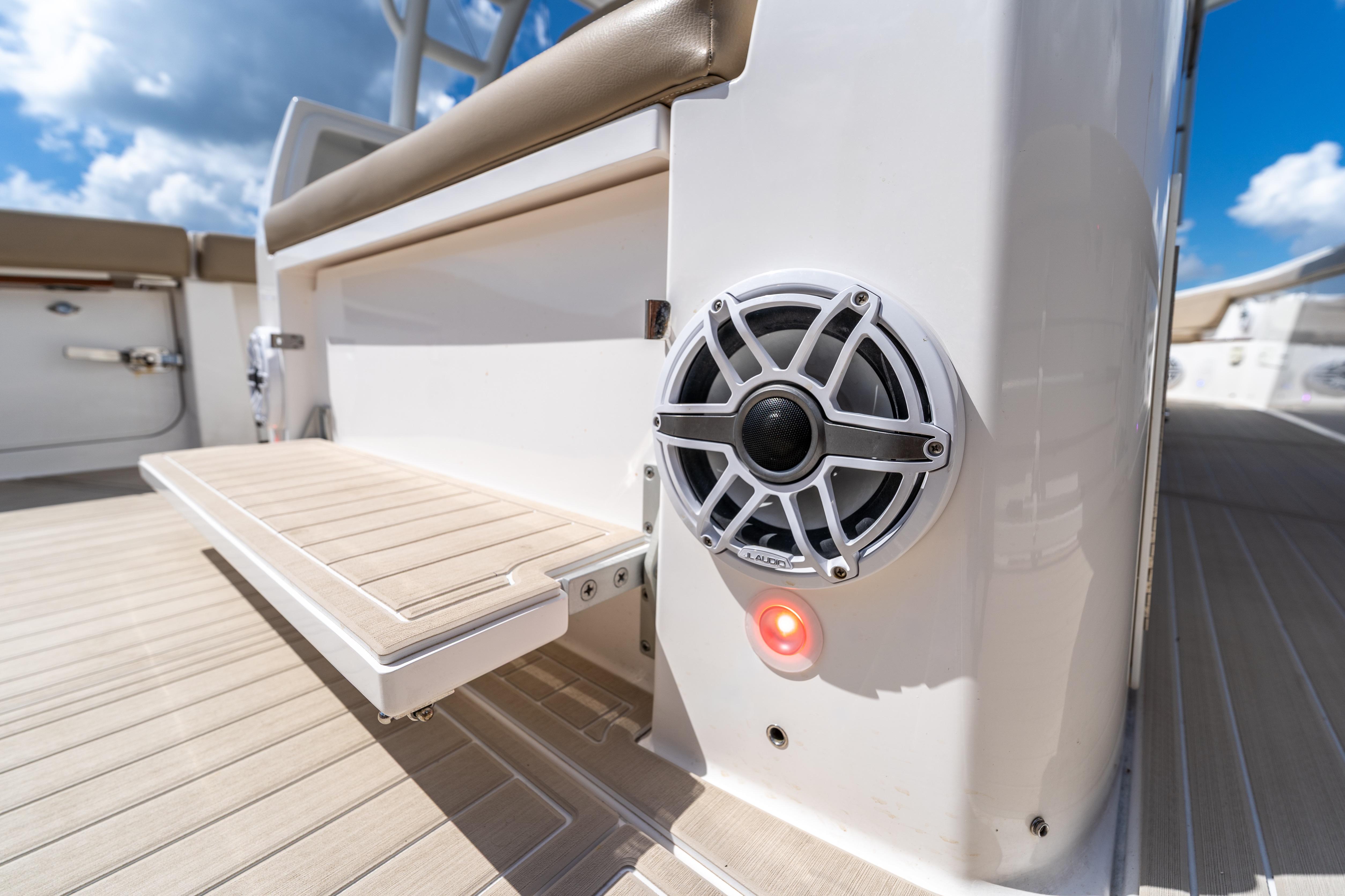 2021 Everglades 395 Center Console boat interior with speaker and seating detail.