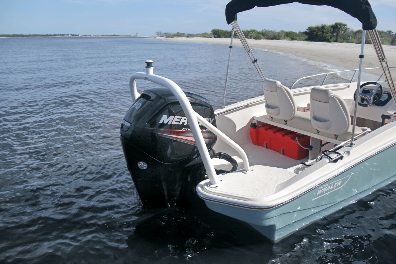 A 2026 Boston Whaler 160 Super Sport is by the shore with a Mercury engine.