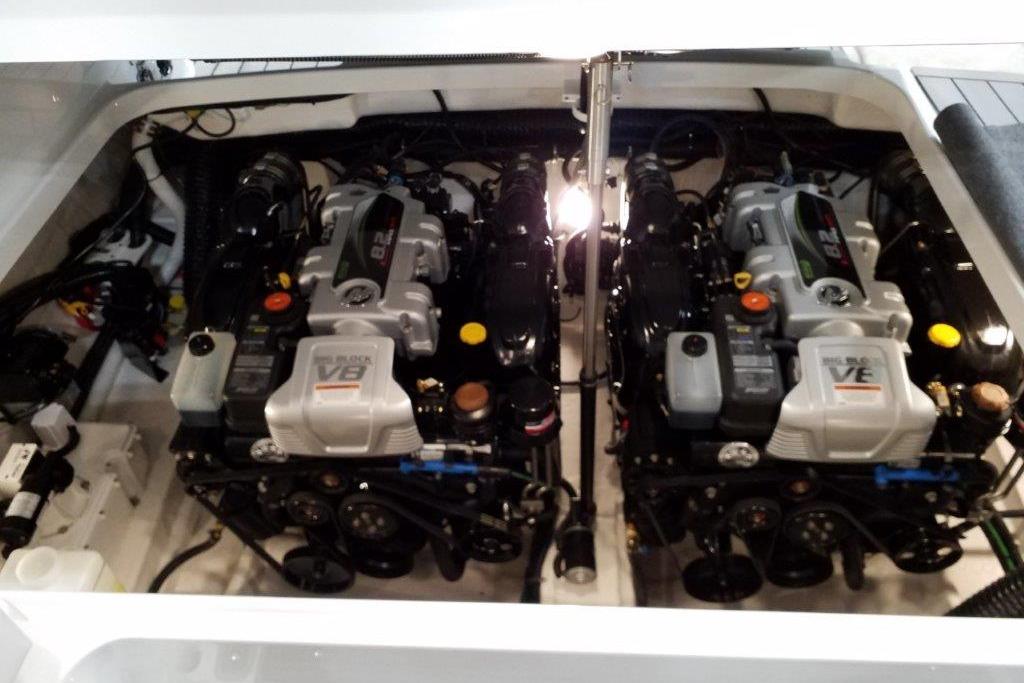 Engine compartment of a 2021 Formula 350 Sun Sport boat, featuring dual V8 engines.