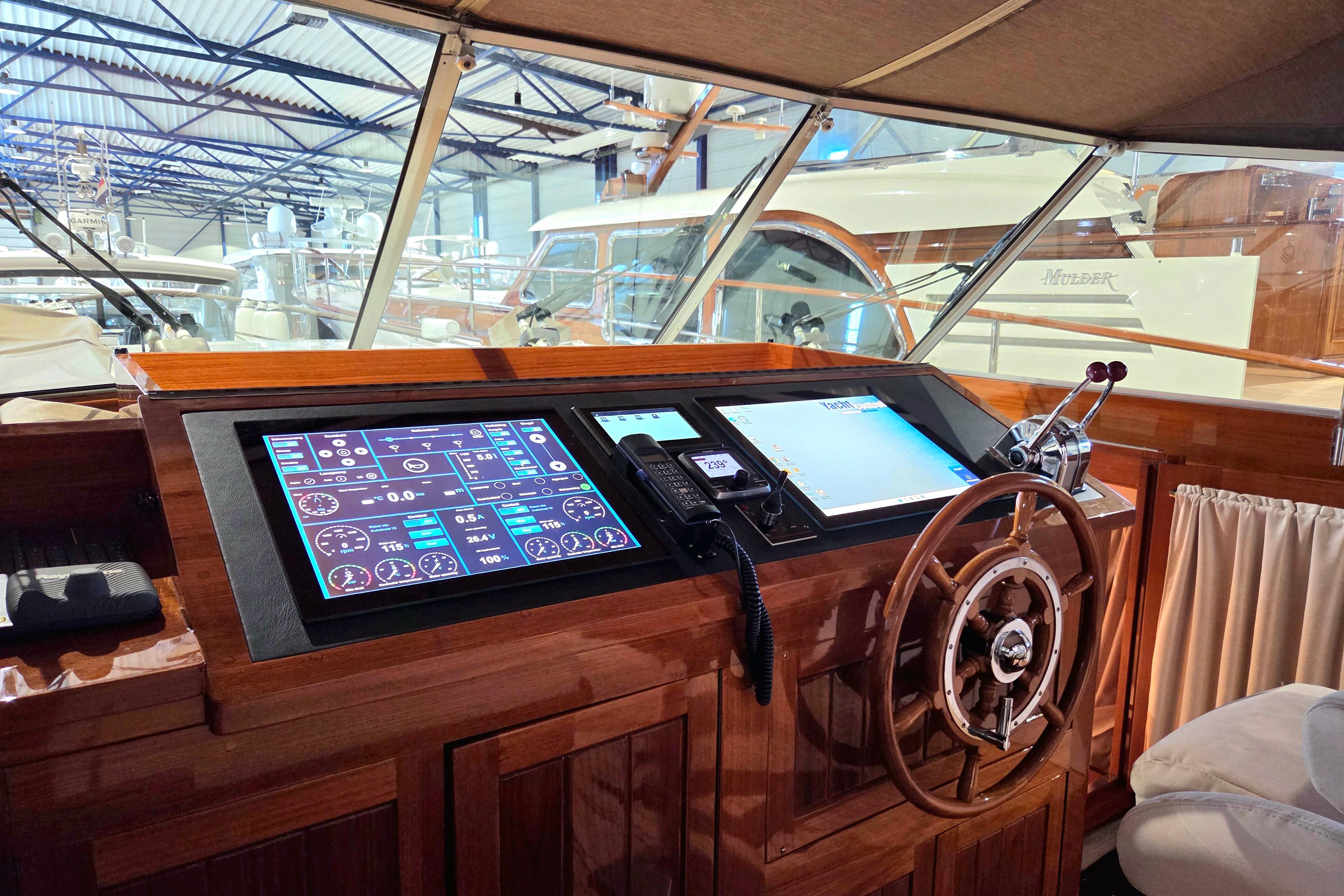 Cockpit of 1999 Super Van Craft 14.95 yacht with modern navigation controls.
