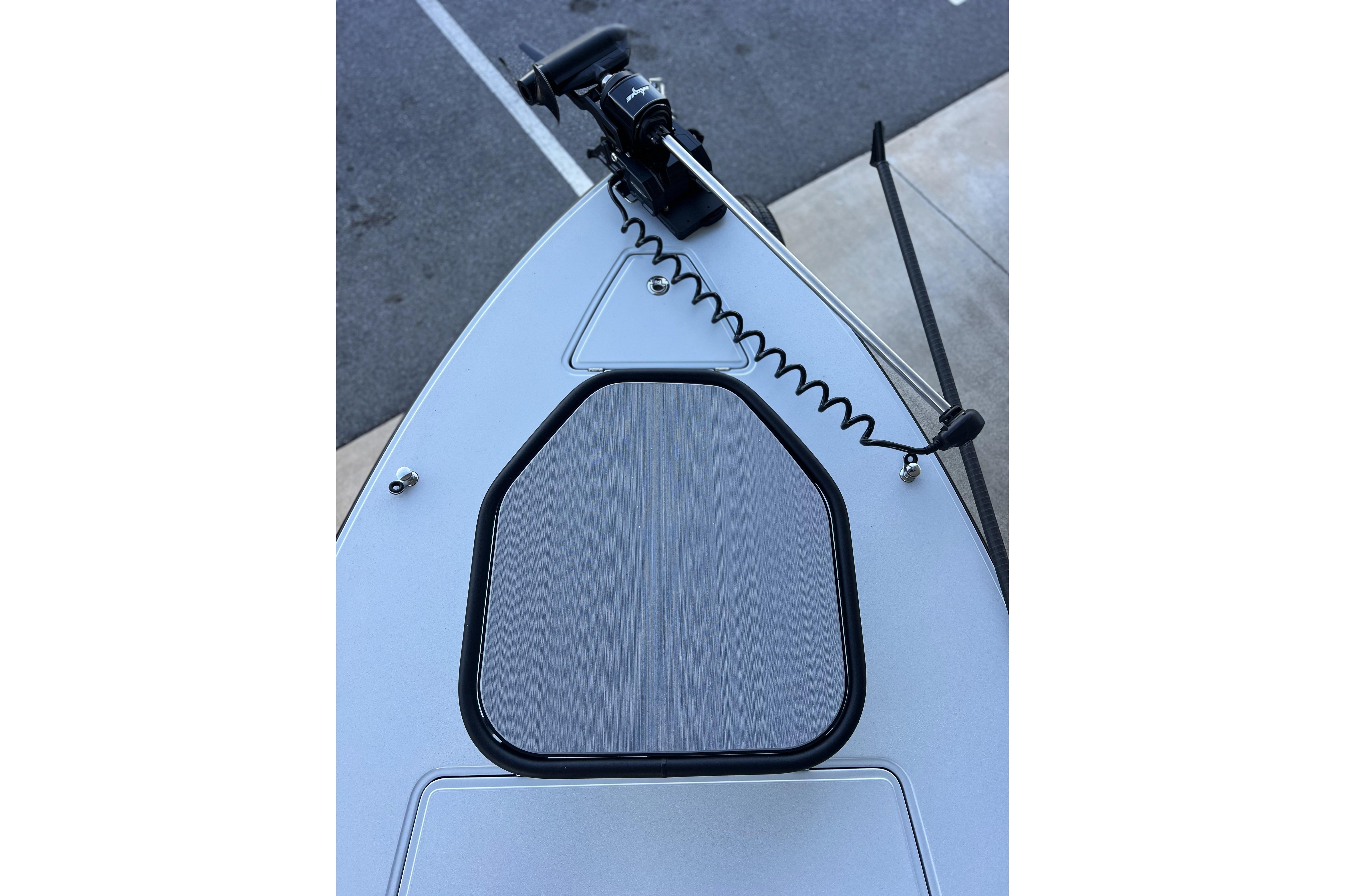 Bow of 2026 Chittum Skiffs 21 Islamorada with trolling motor and hatch.