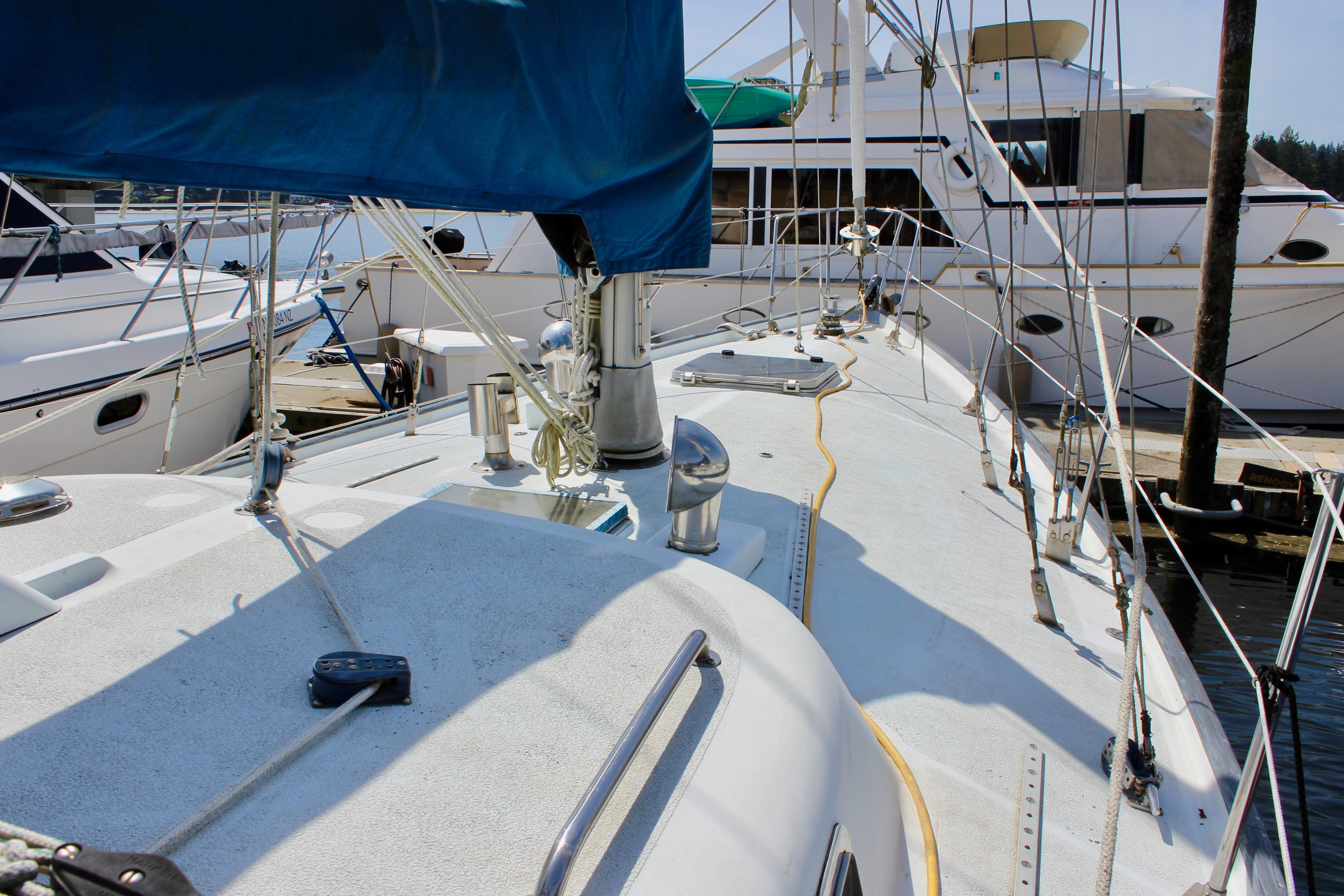Sailboat deck view of 1993 Freya 39 model docked at marina.