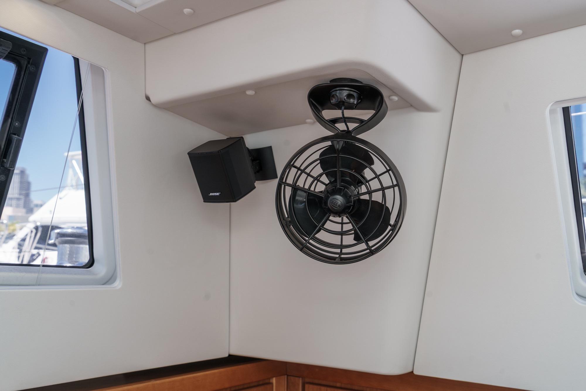 Interior of 2017 Beneteau Sense 50 yacht with fan and speaker setup.