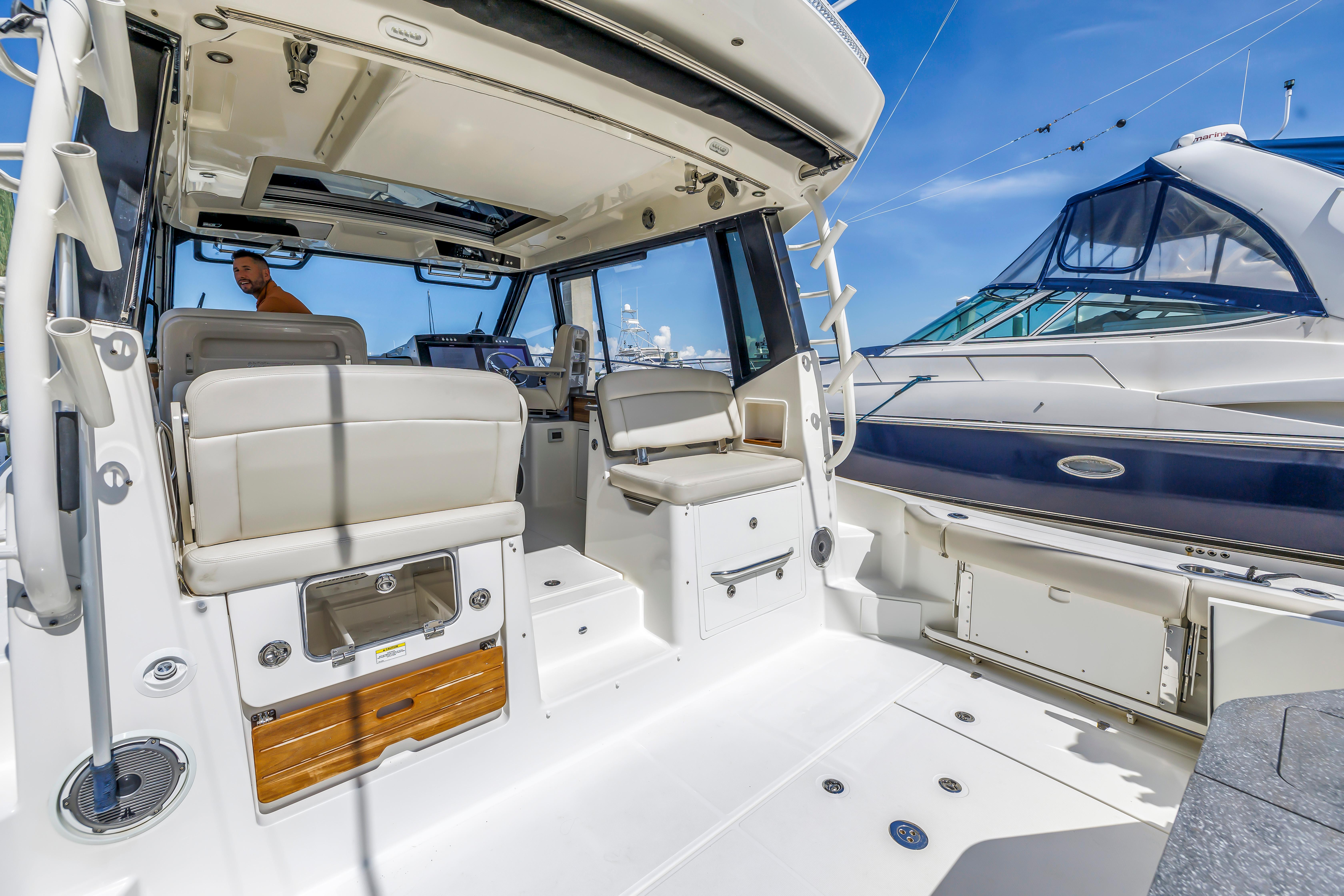 2023 Boston Whaler 405 Conquest interior with seating, helm, and modern design.