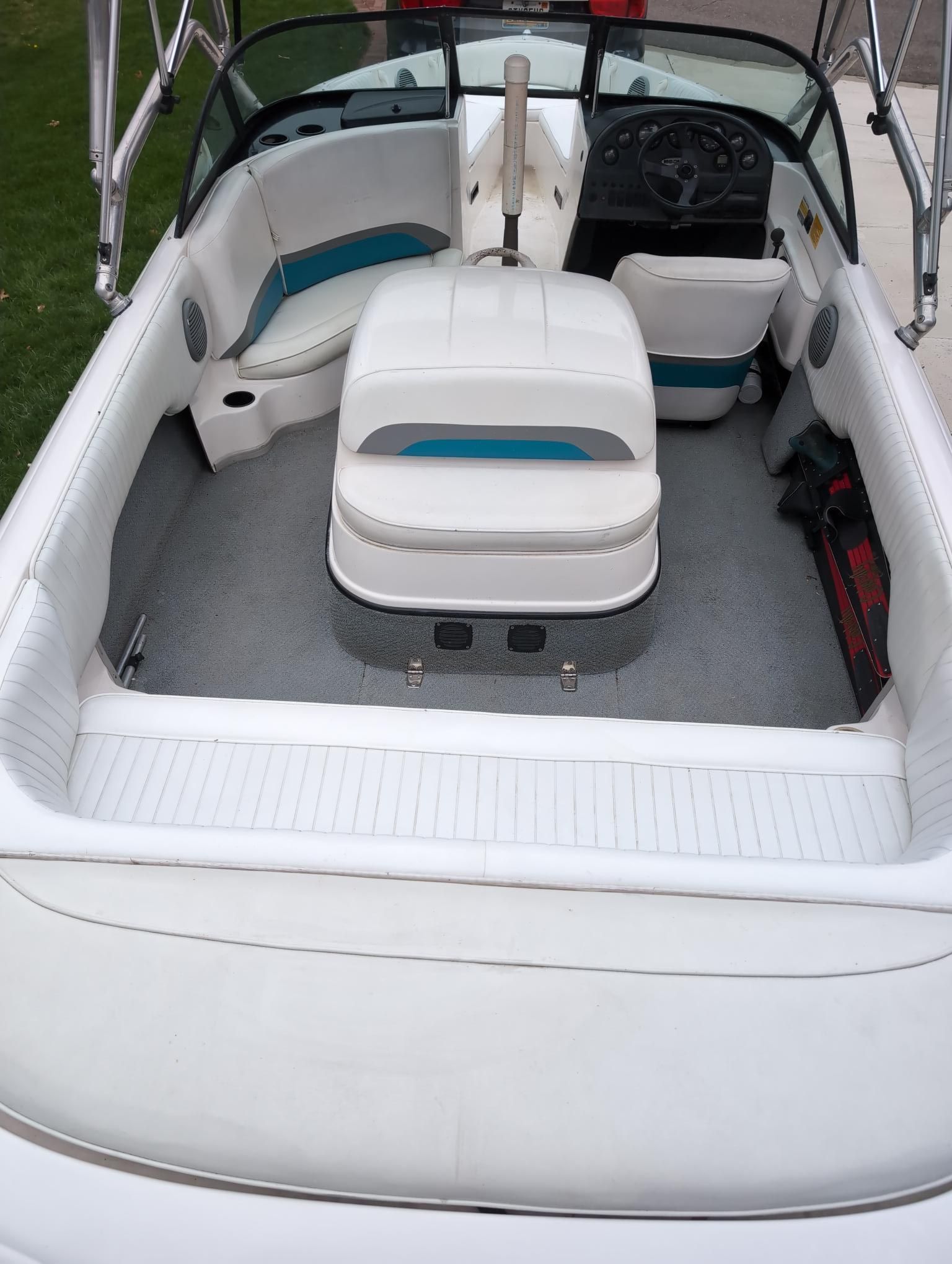 The image shows the interior of a 2000 Moomba Ouback LS boat with white seating.