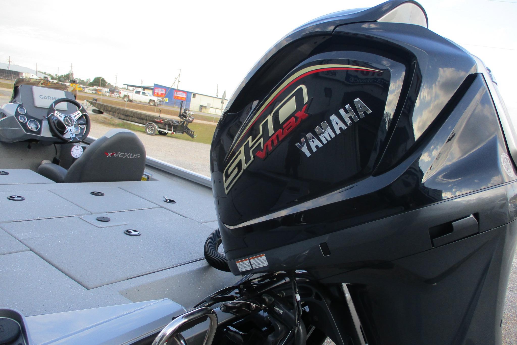 2026 Vexus AVX2080 boat with Yamaha VMAX engine, featuring modern dashboard and seating.