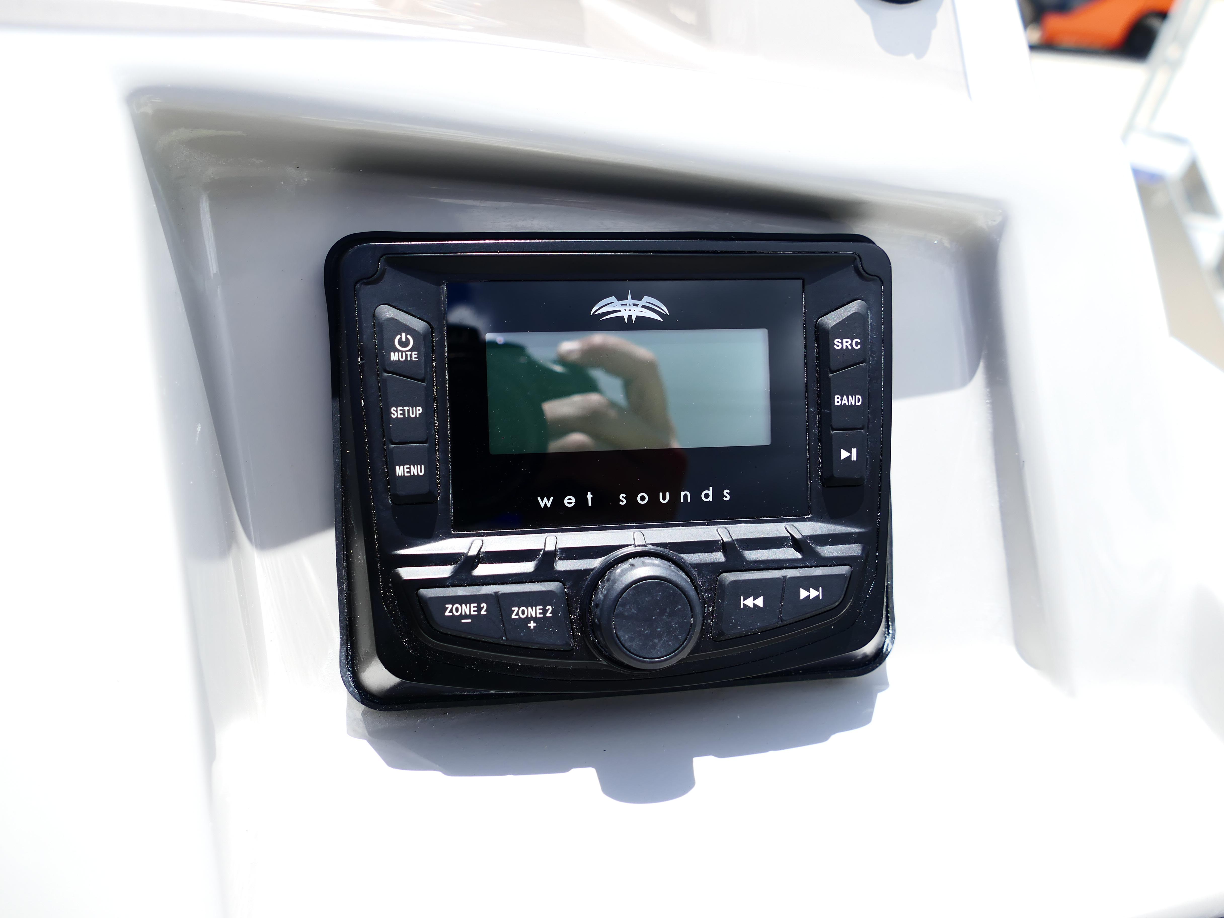 Audio control panel on 2026 Starcraft SVX 231 OB DH boat dashboard.