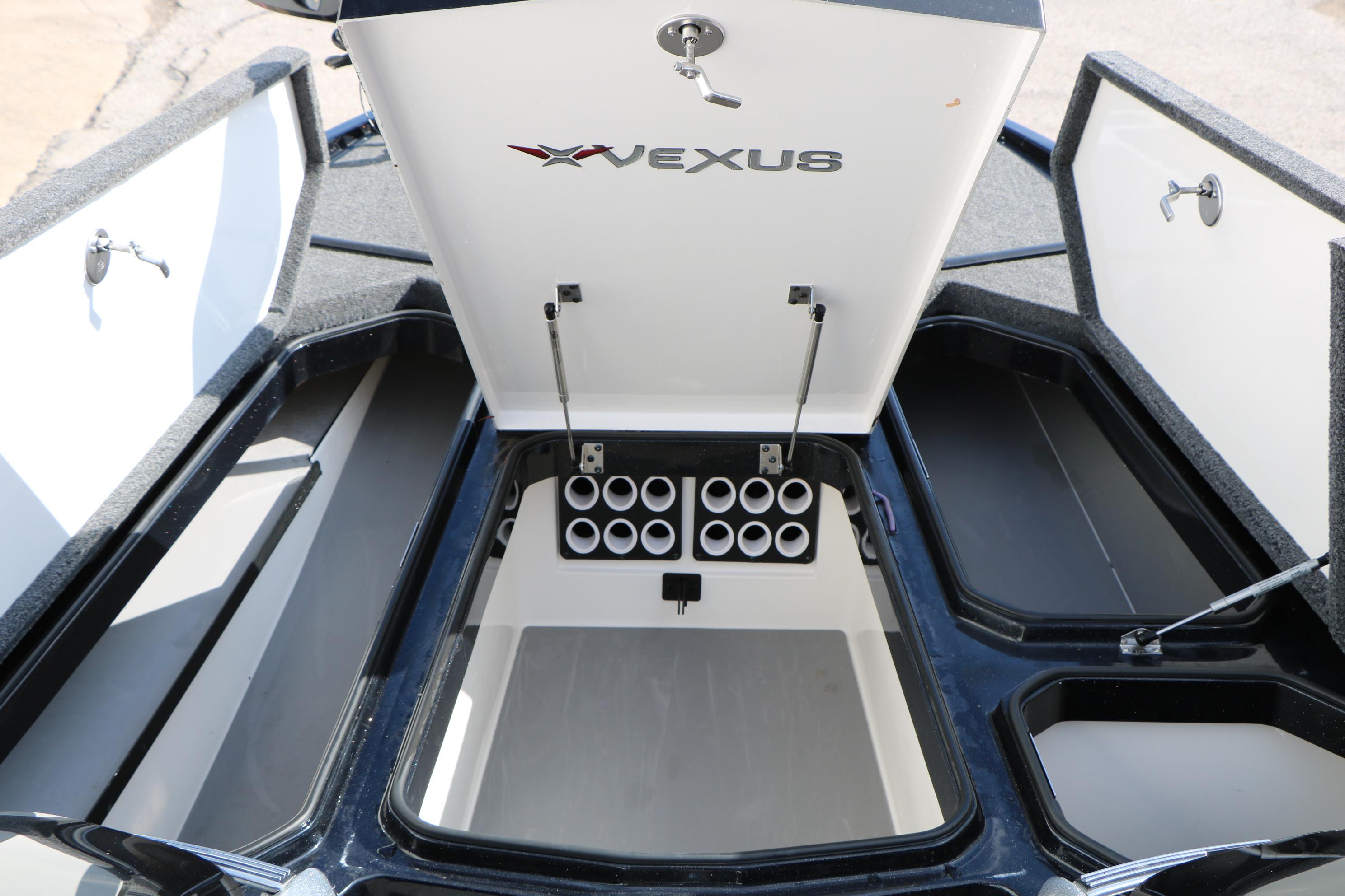 2022 Vexus VX21 boat storage compartments with open lids and rod holders.