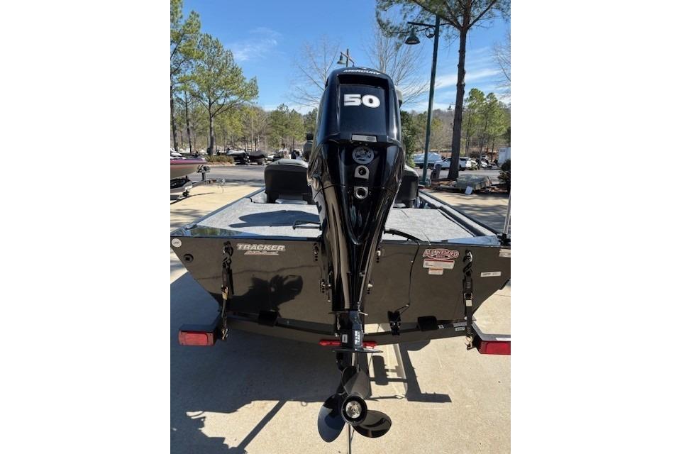 2026 Tracker Bass Tracker Classic XL boat with 50 HP outboard motor, rear view.
