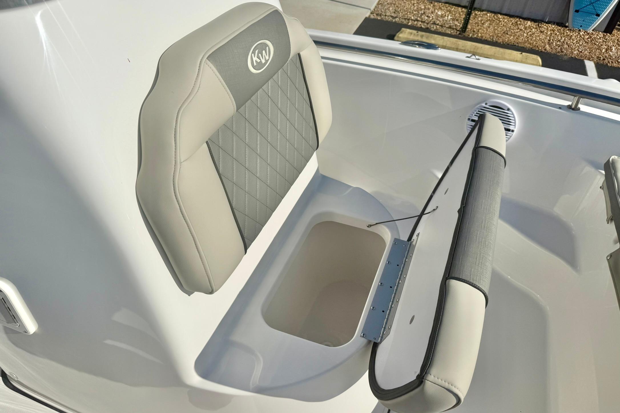 2026 Key West 189 FS boat seat with storage compartment, featuring gray and beige upholstery.