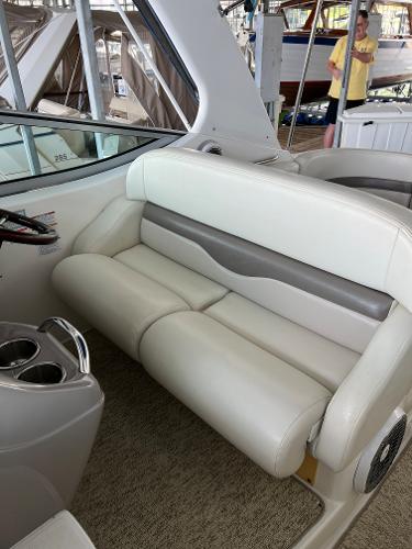 Interior of a 2008 Chaparral Signature 310 with beige leather seating.