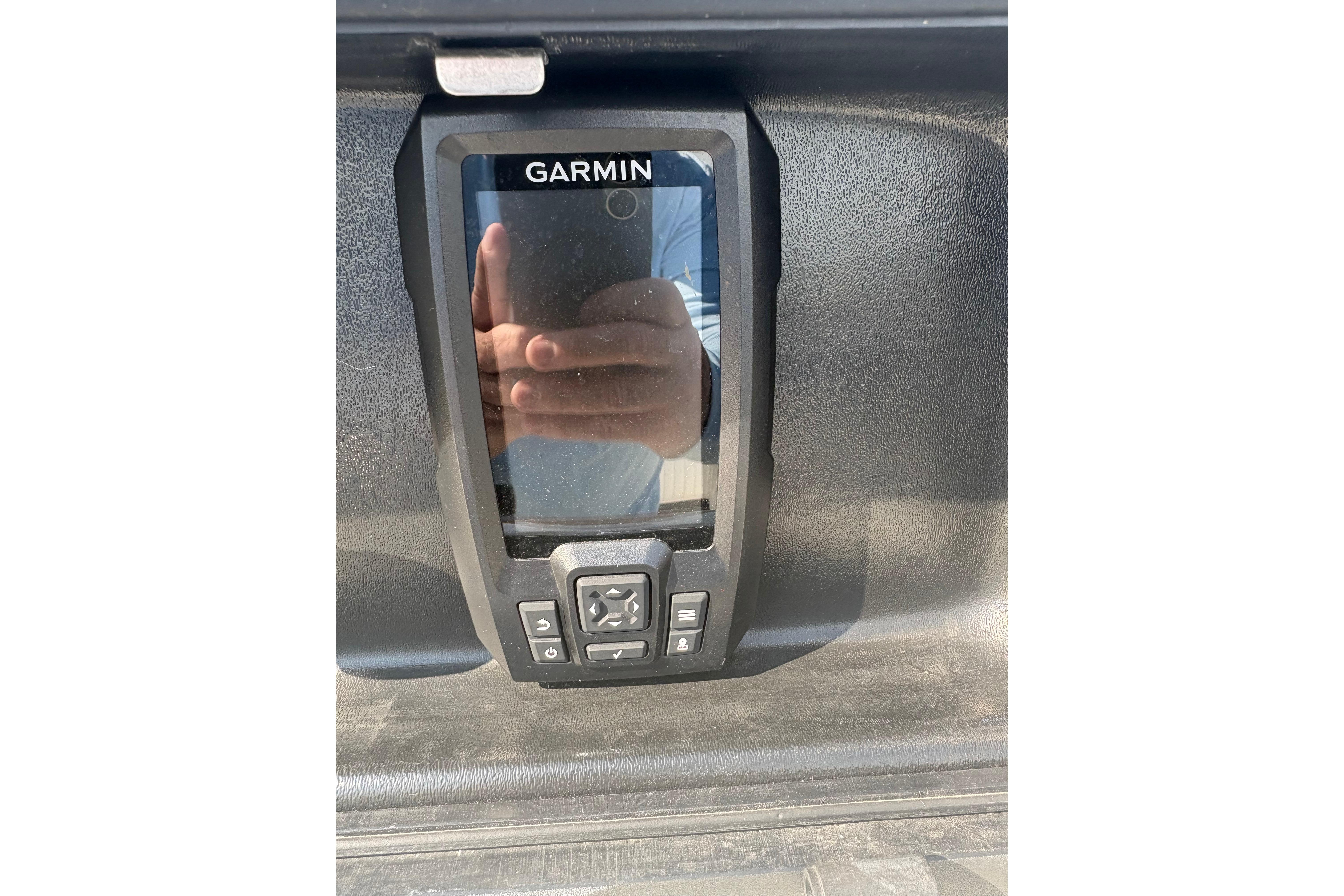 Garmin device on a 1993 Boston Whaler 21 Outrage boat dashboard.
