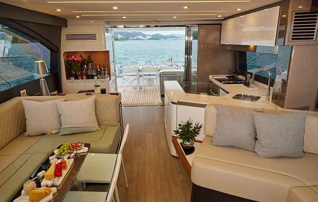 Luxurious interior of 2025 Schaefer 660 yacht with modern kitchen and ocean view.