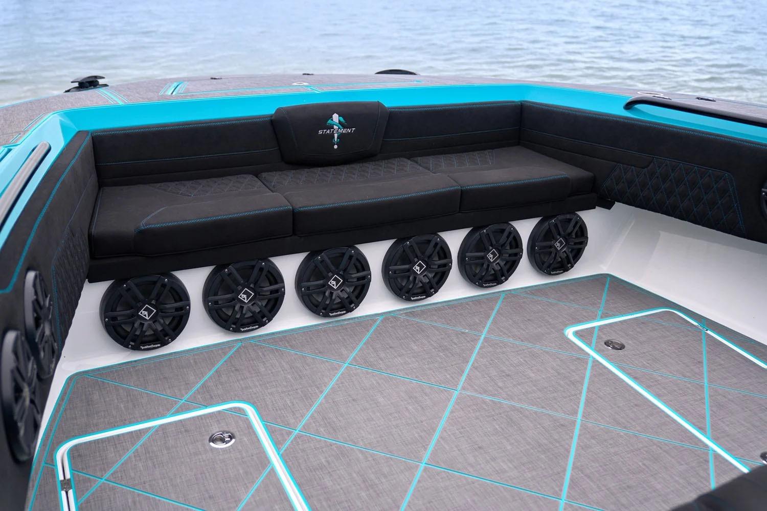Manufacturer Provided Image: Luxurious interior of 2025 Statement 430 Tigress boat with stylish seating and premium speakers.