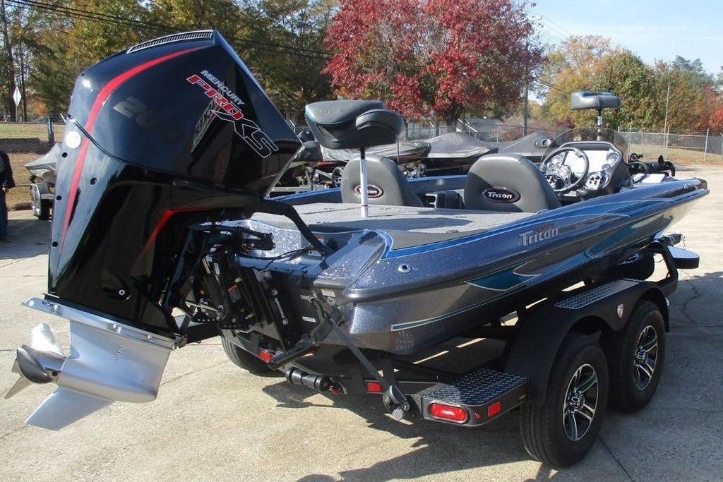2026 Triton 18 TrX bass boat with powerful outboard motor, parked on a trailer.