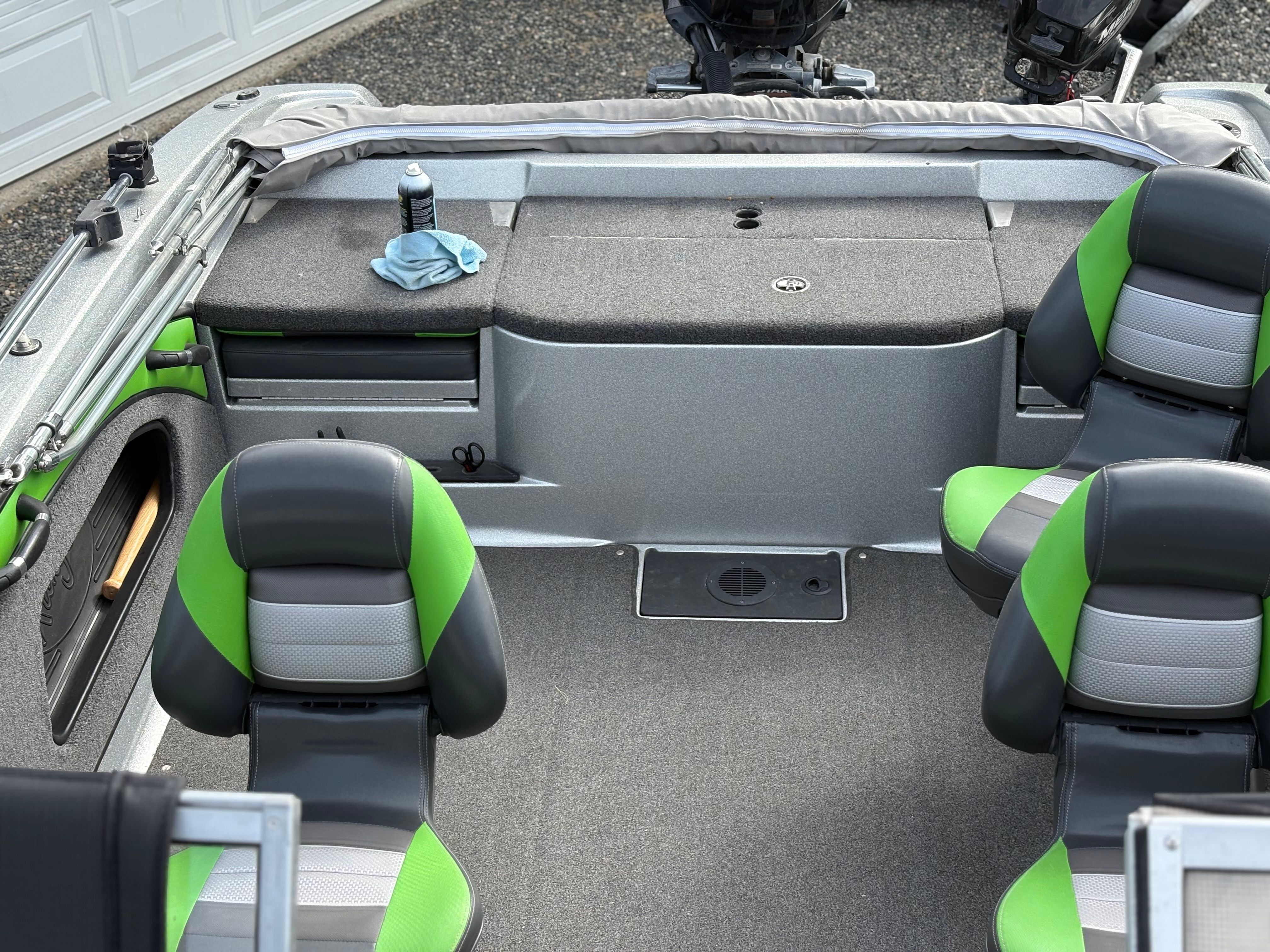 The image shows the interior of a 2019 Ranger 1880MS Angler boat with green seats.