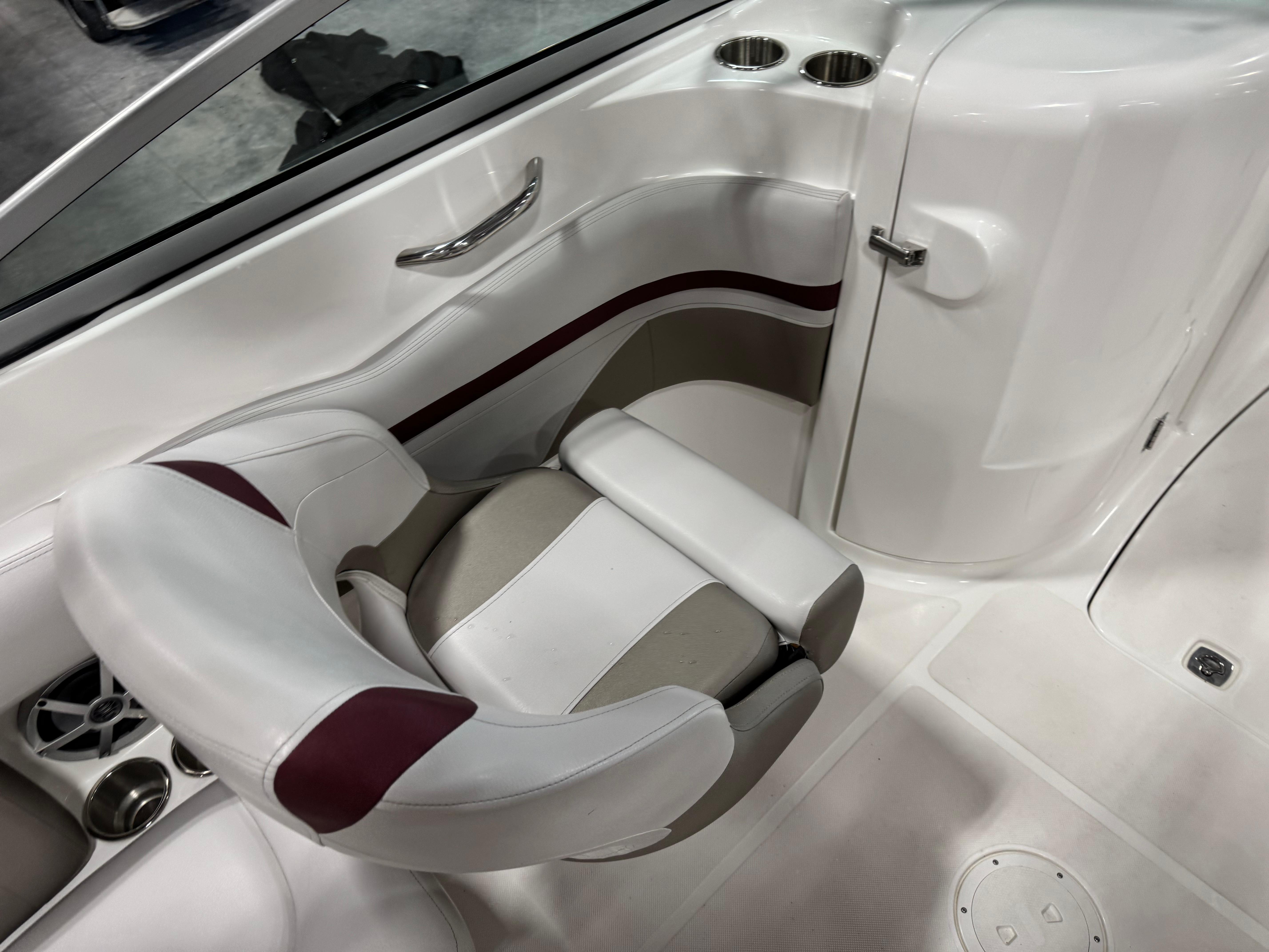 2017 Hurricane SD 2200 DC boat interior with white and maroon seating, cup holders, and sleek design.