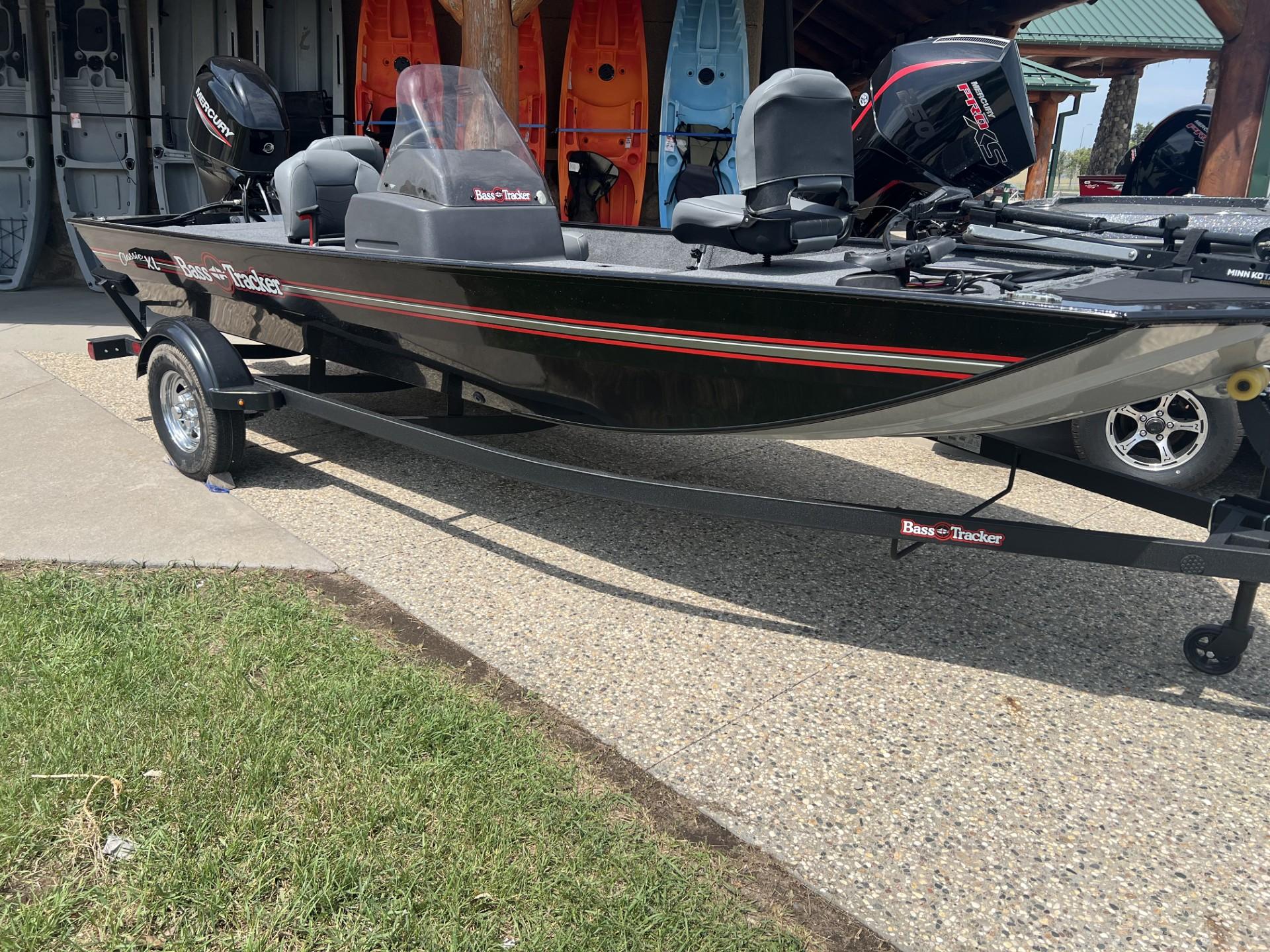 2025 Tracker Bass Tracker Classic XL boat on trailer, parked outdoors.