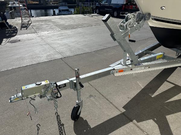 2023 Defiance Admiral 220 EX boat trailer hitch in a marina setting.