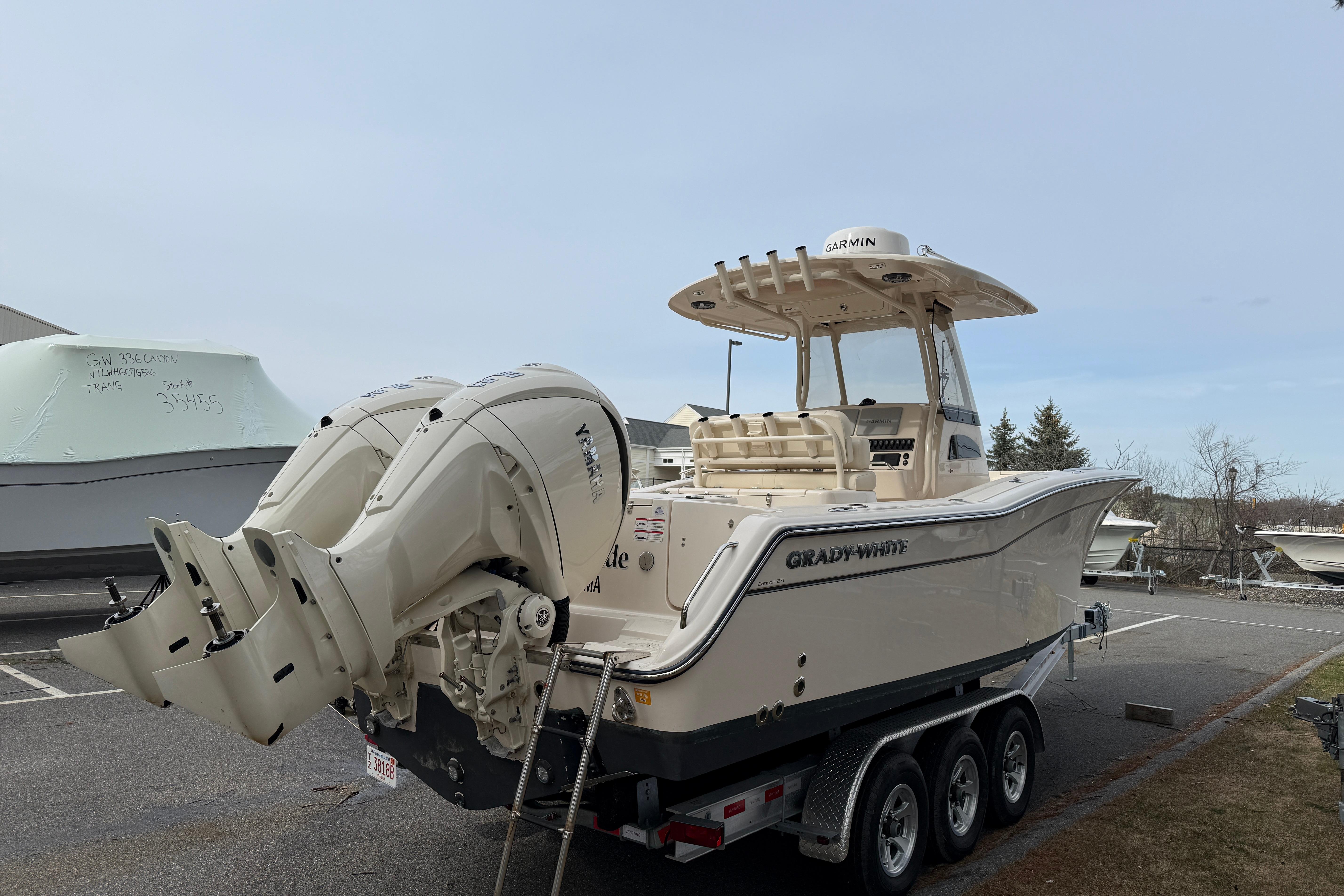 2024 Grady-White Canyon 271 boat with dual engines on a trailer.