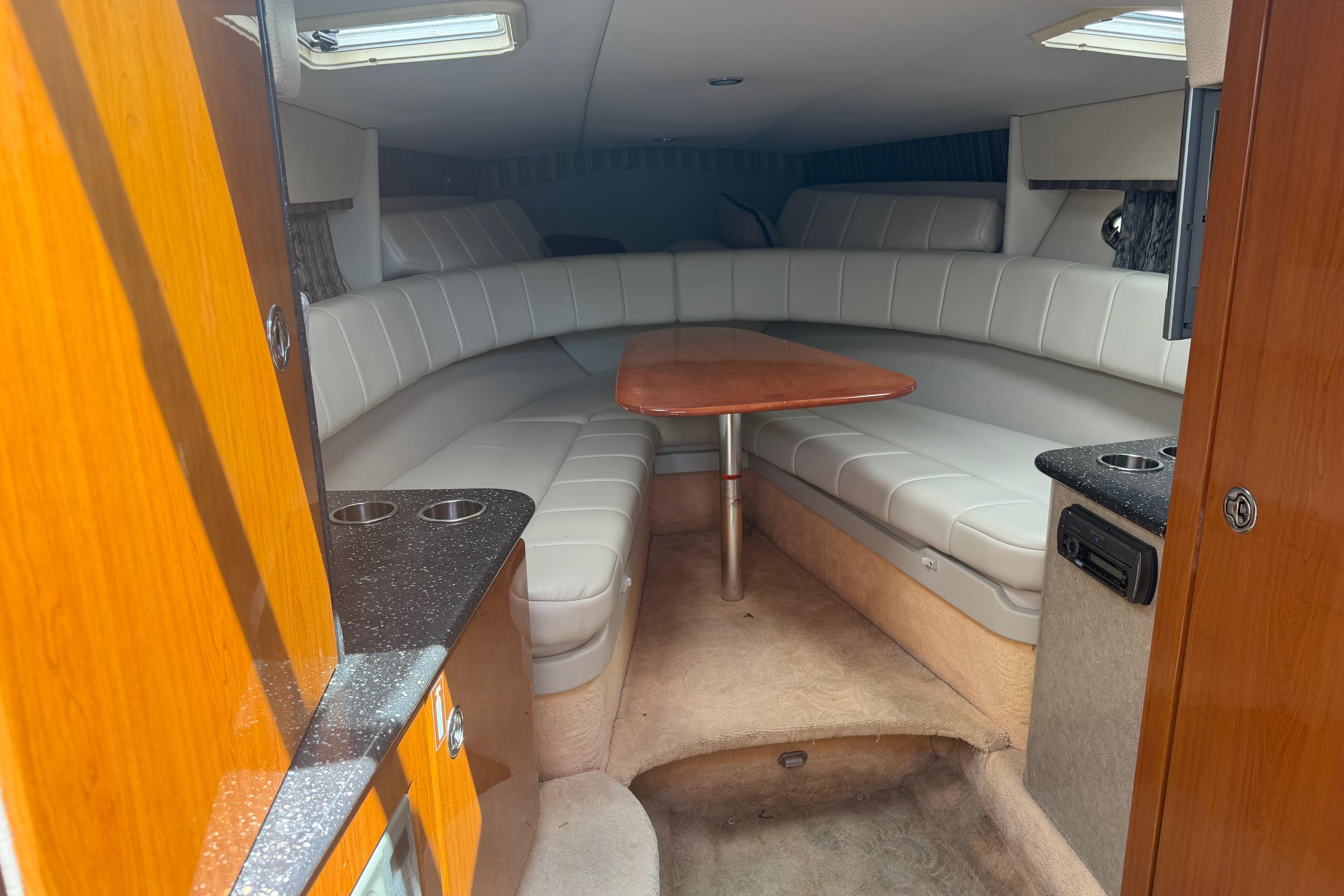 2006 Formula 330 Sun Sport cabin interior with seating and table.