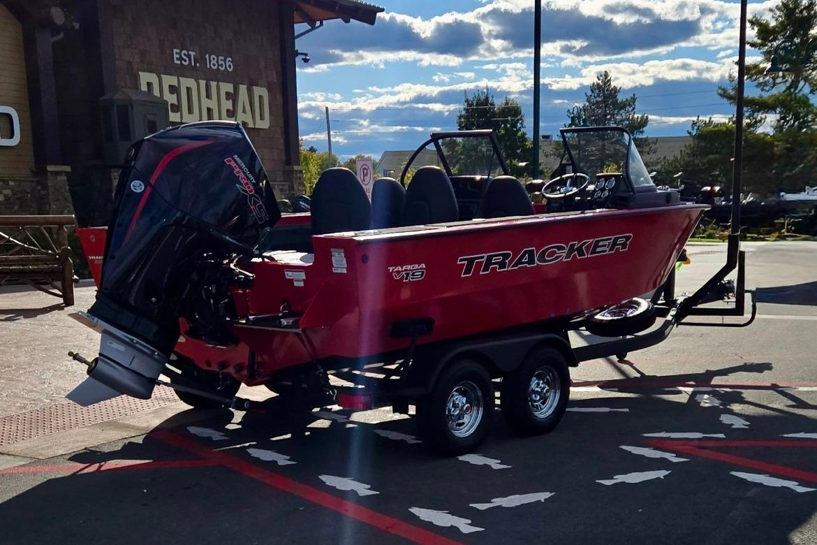 2026 Tracker Targa V-19 Combo boat on trailer, parked outdoors.