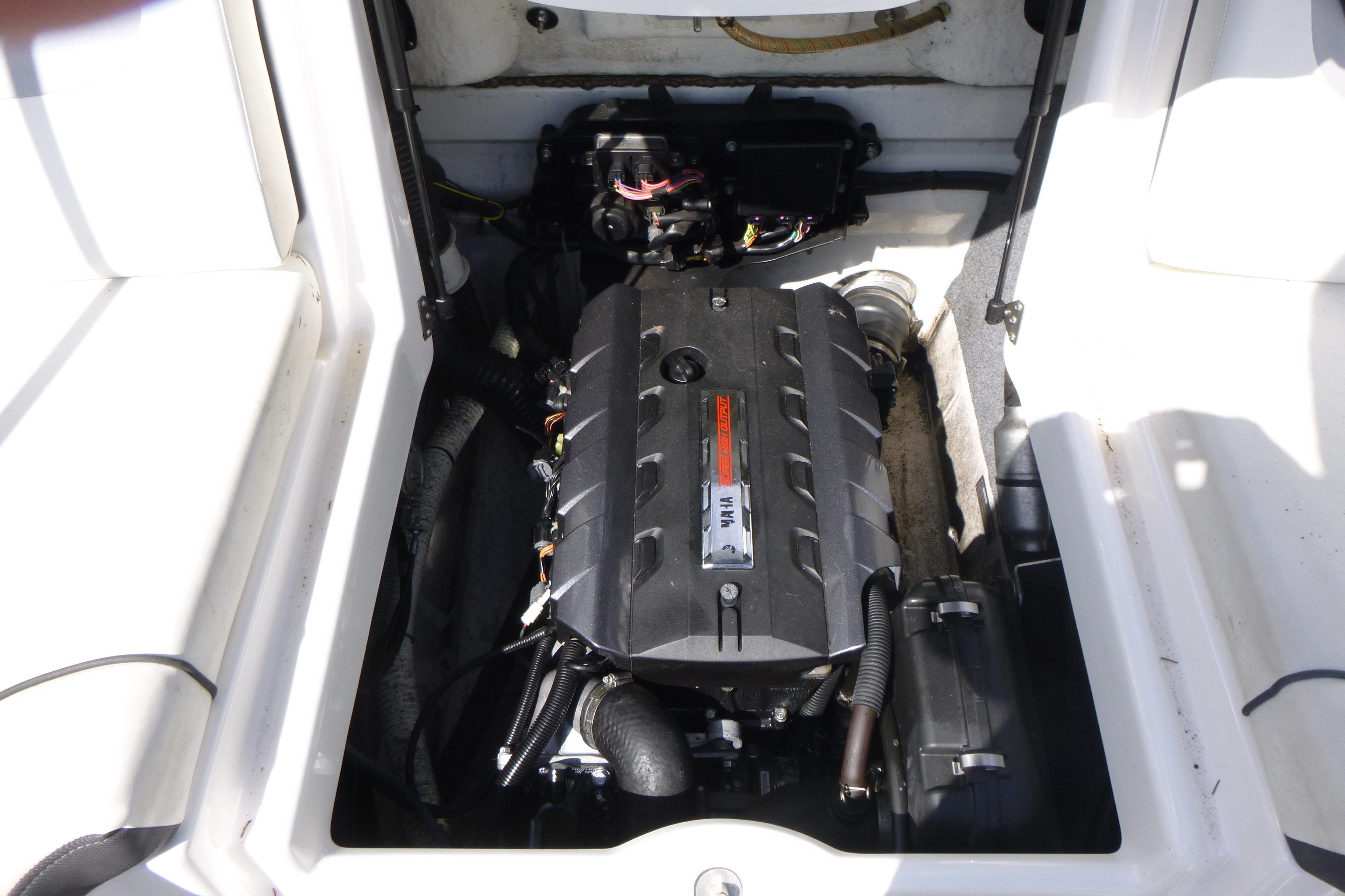 Engine compartment of a 2015 Yamaha Boats SX192, showcasing the internal mechanics.