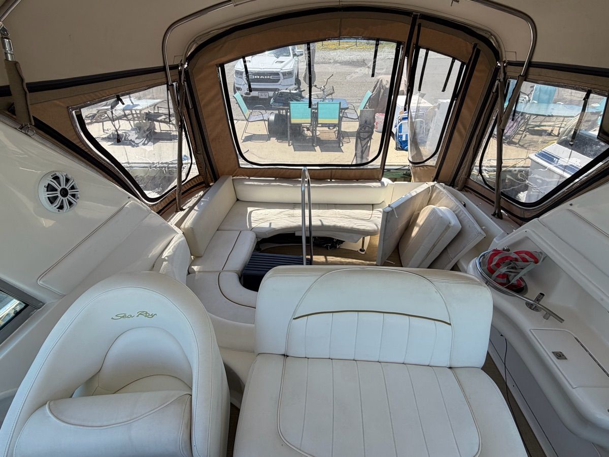 Interior of a 2001 Sea Ray Sundancer 310 with white leather seating.