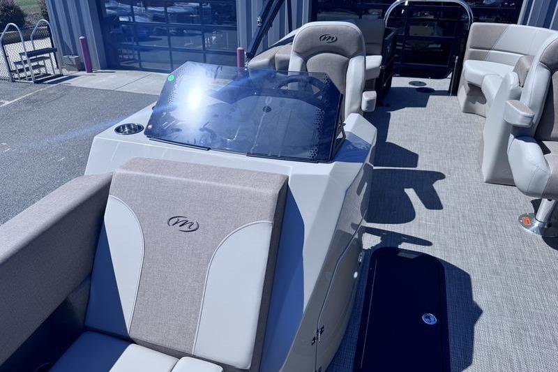 2027 Manitou Aurora 23 RF SHP pontoon boat interior with plush seating and modern dashboard.