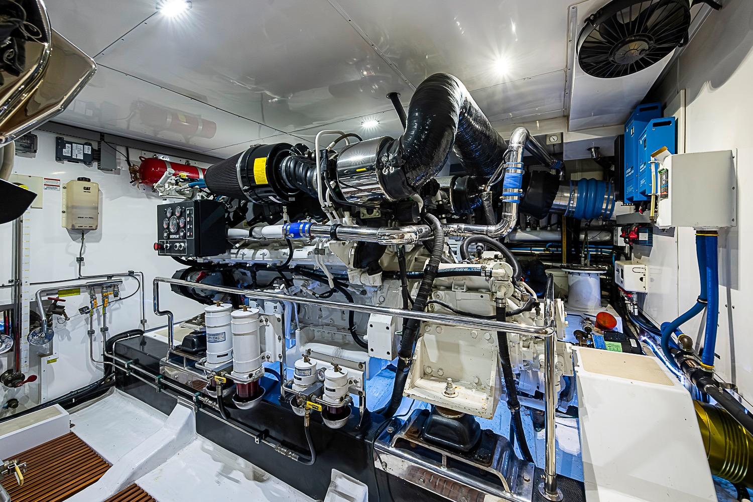 Engine room of 2014 Marlow 80 Explorer yacht, showcasing advanced machinery and equipment.