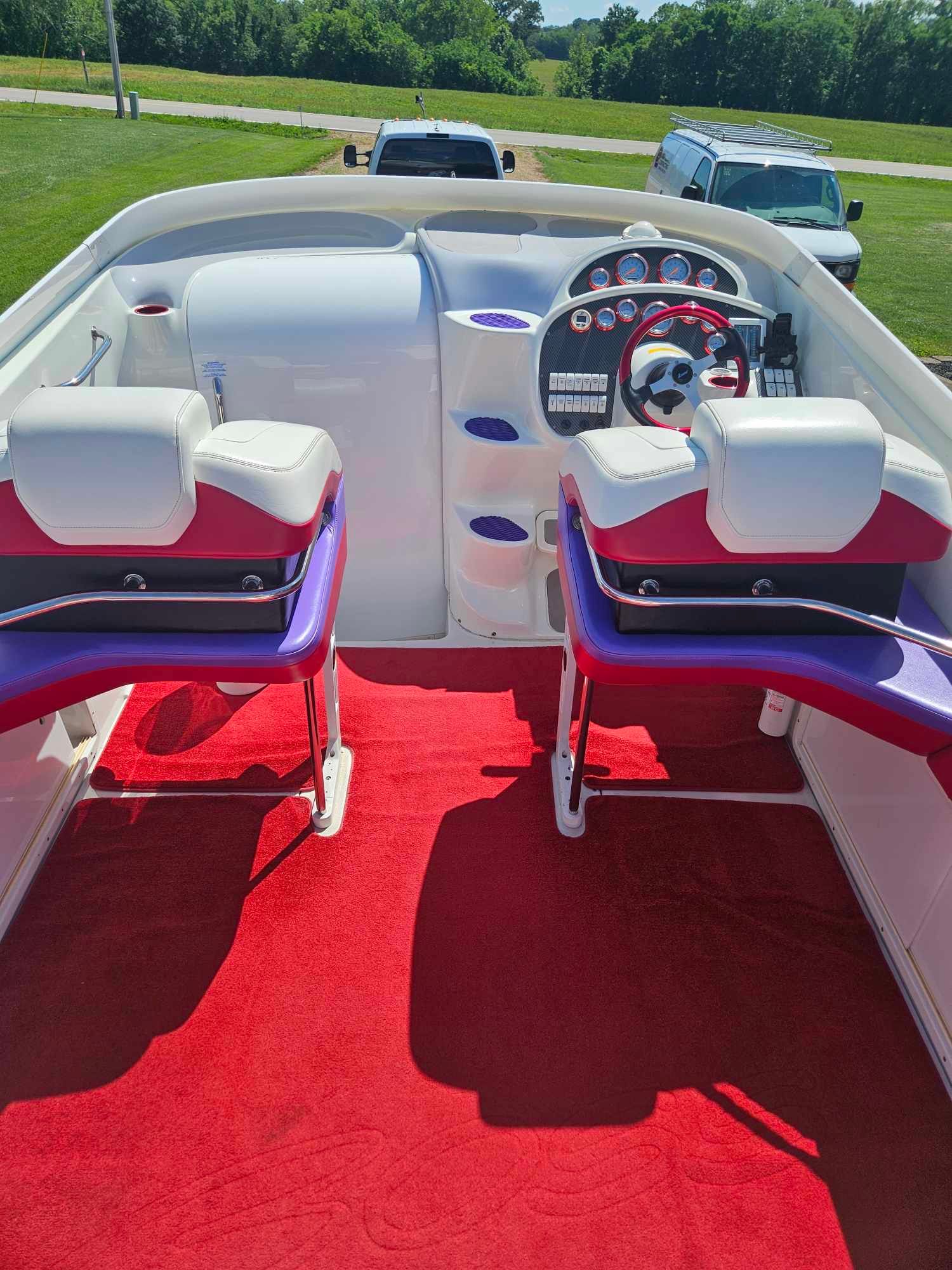 Interior of a 1997 Baja 38 Special Boss boat with red carpeting.