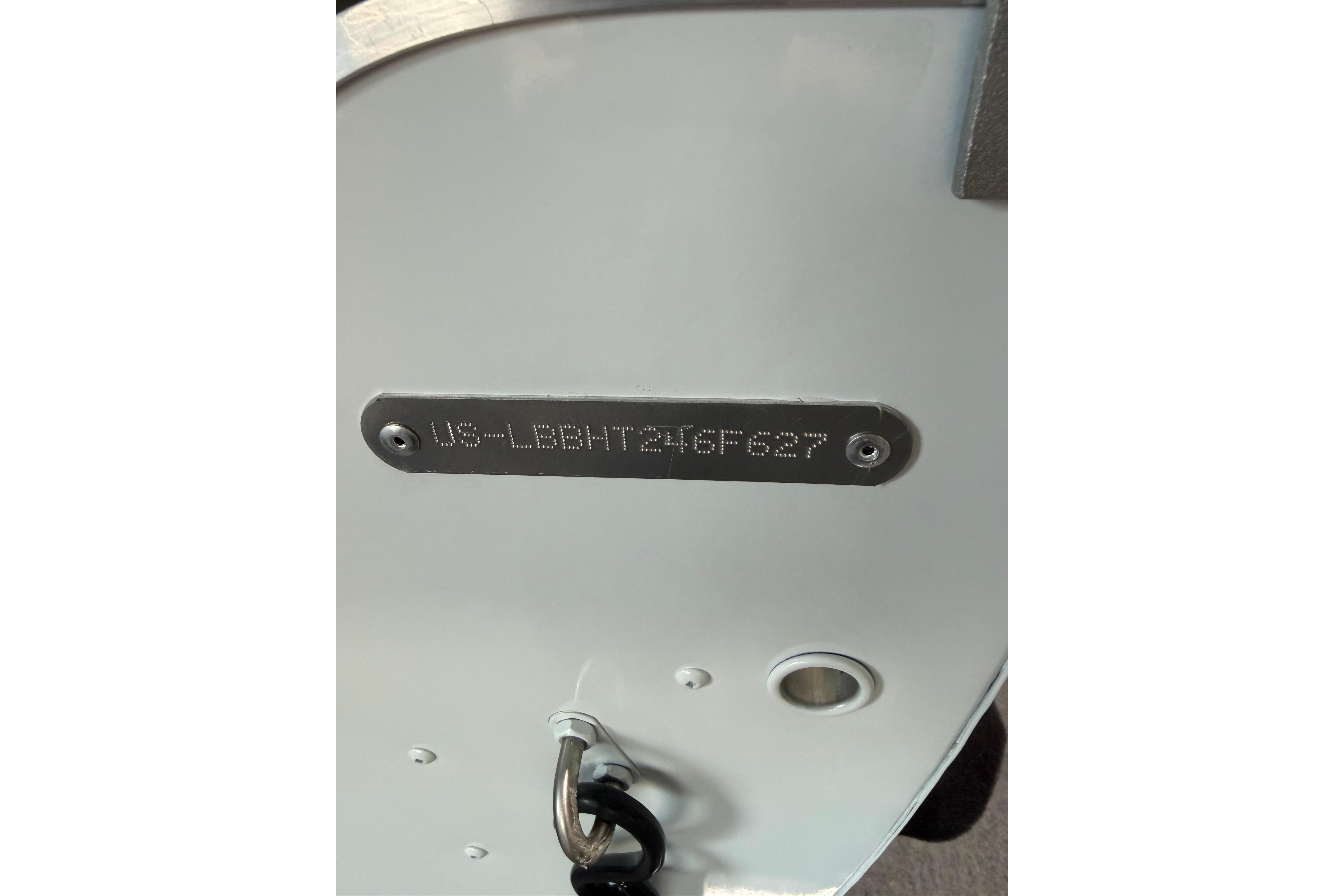 2027 Lund 1600 Fury SS boat hull identification number plate.