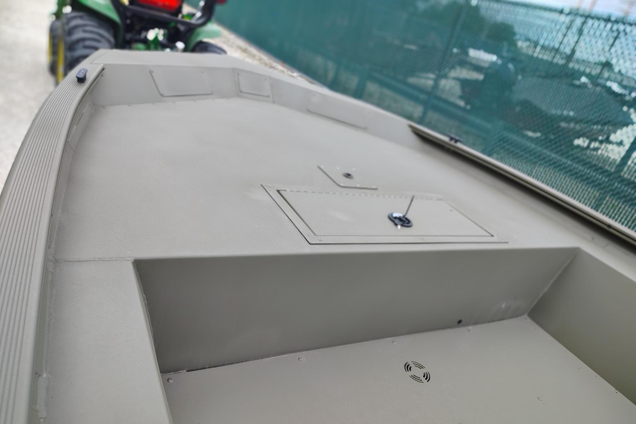 2026 Tracker Grizzly 1754 Utility boat deck, featuring storage compartment and durable design.