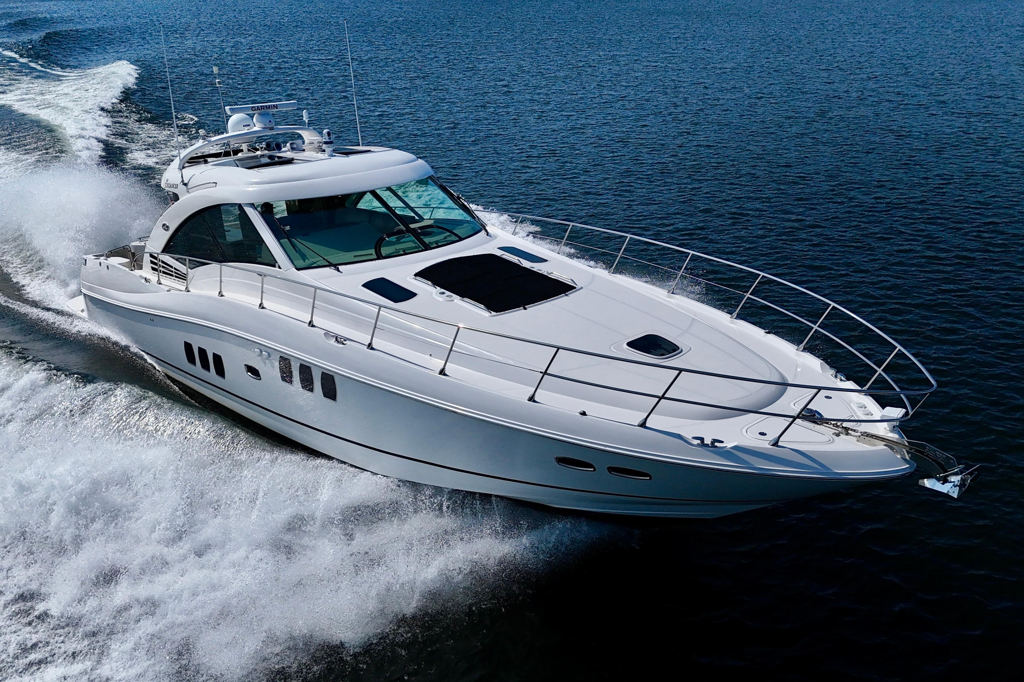 2008 Sea Ray 60 Sundancer yacht cruising on open water, showcasing sleek design and luxury.