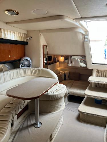 Interior of a 2001 Sea Ray 340 Sundancer yacht with elegant furnishings.