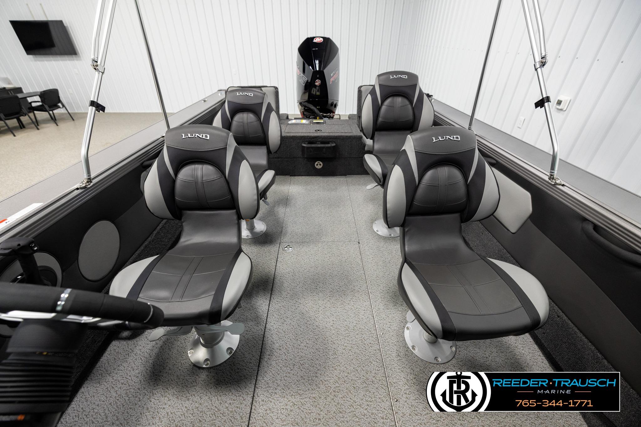 Interior of 2026 Lund 1975 Tyee boat with four cushioned seats.