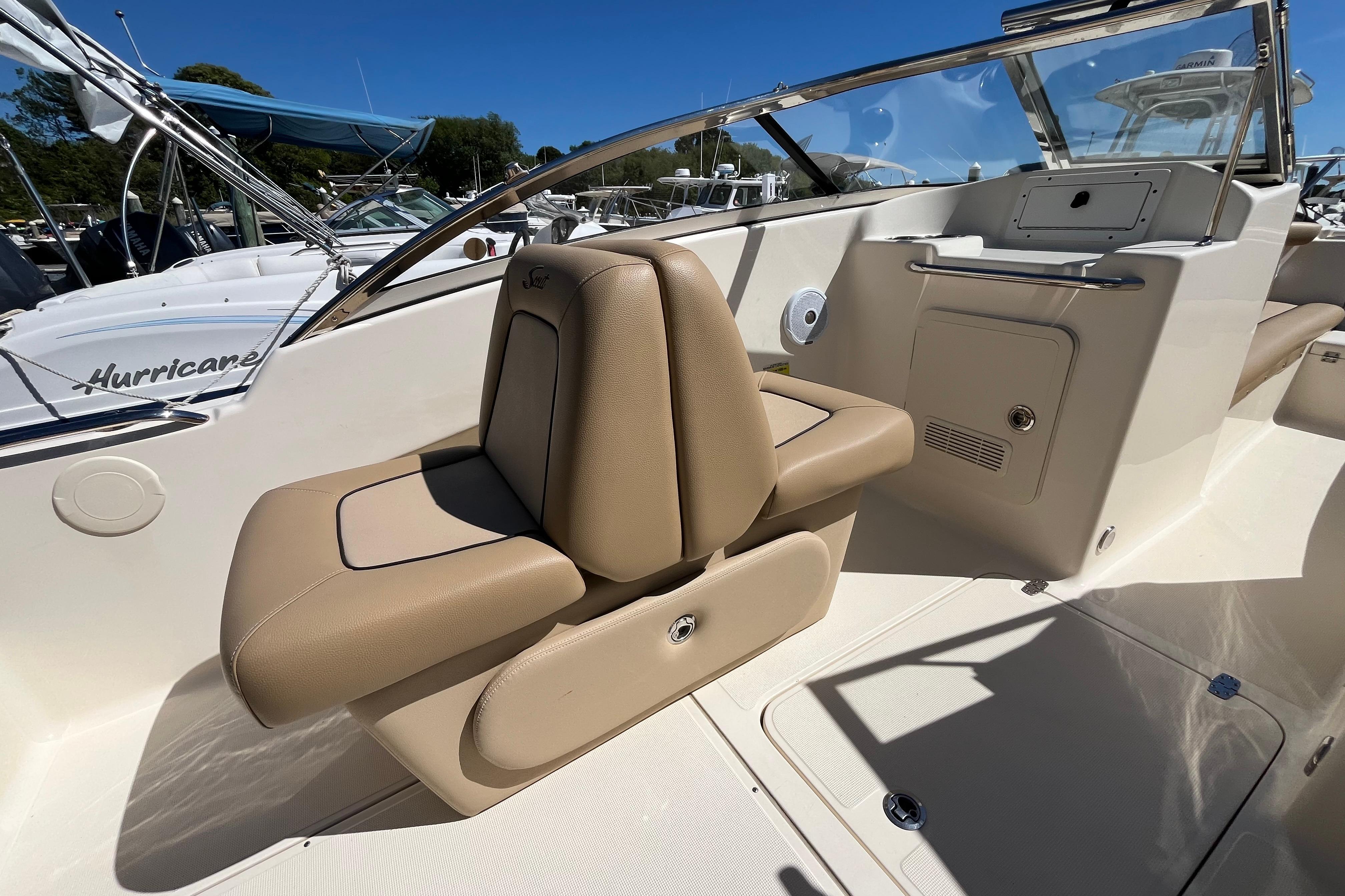 2017 Scout 210 Dorado boat interior with tan seating and console.