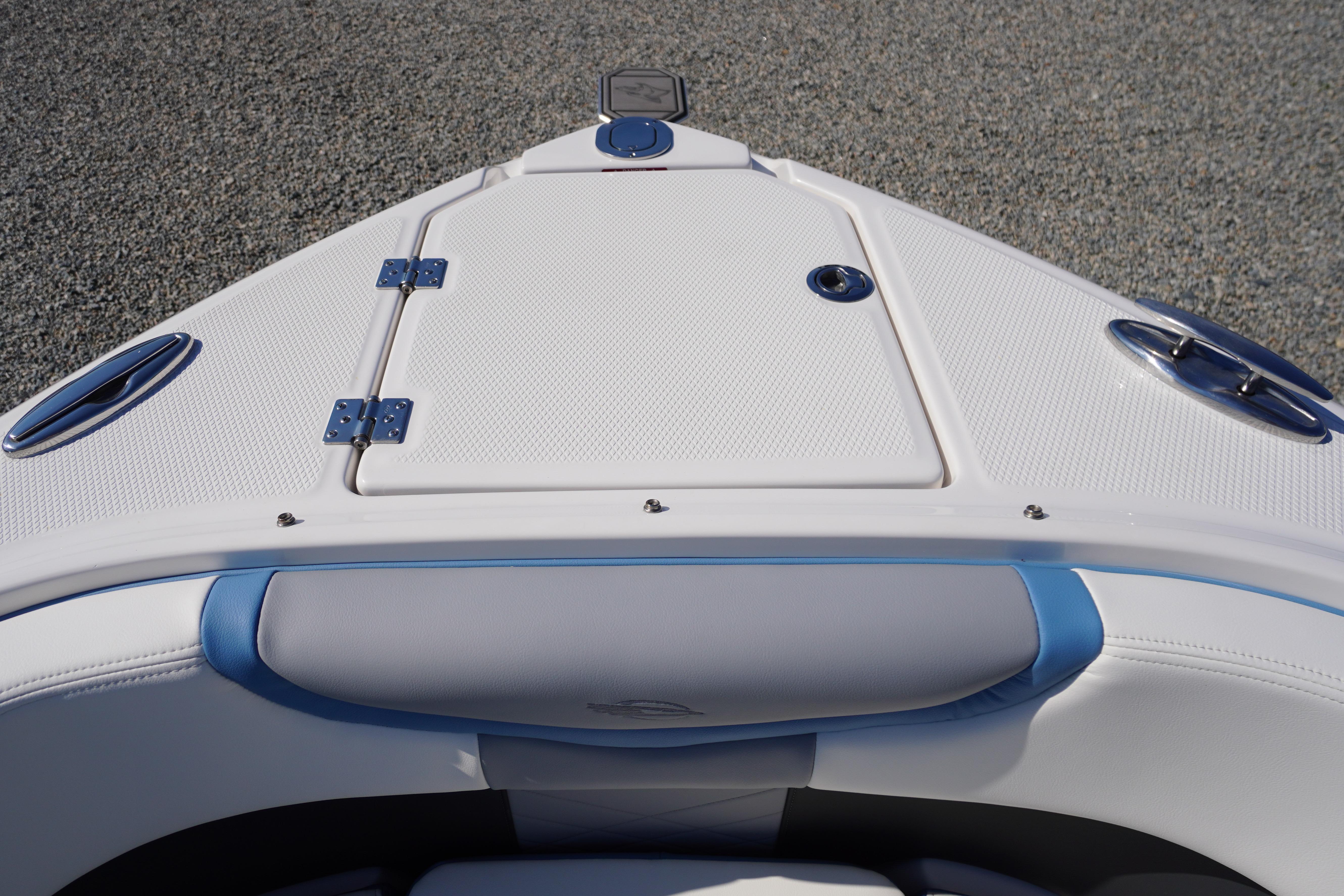 Bow view of 2026 Chaparral 270 OSX boat with sleek white and blue design.