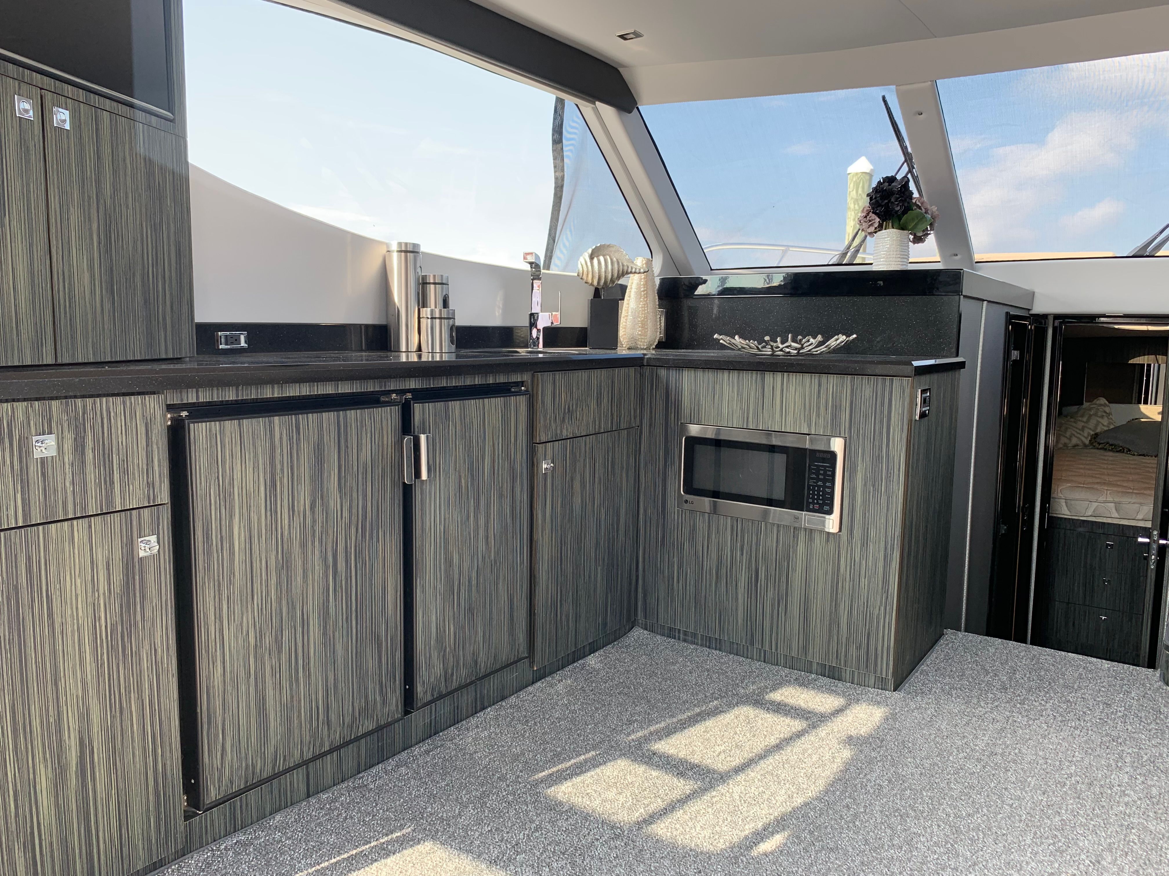 Interior of Silverton 4100 SC yacht, modern kitchen, 2019 model.