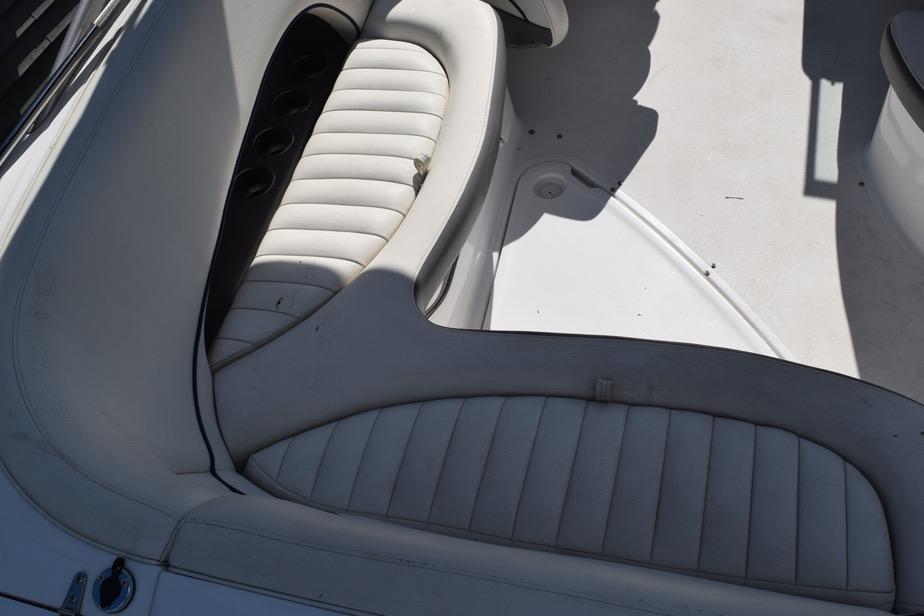 Interior seating of a 2006 Cobalt 240 boat, featuring white cushioned seats.