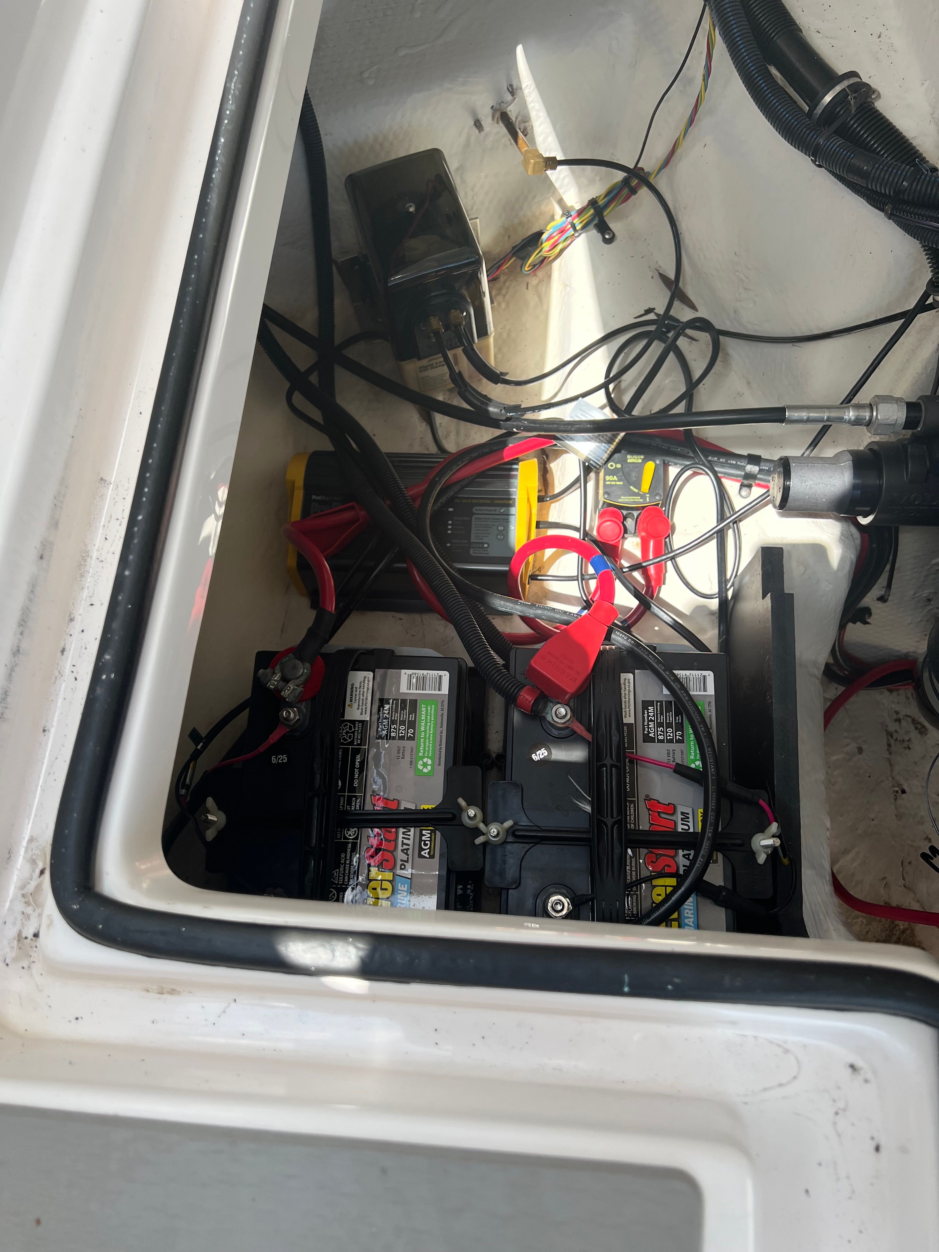 Battery compartment of a 2014 Regal 24 FasDeck RX boat.
