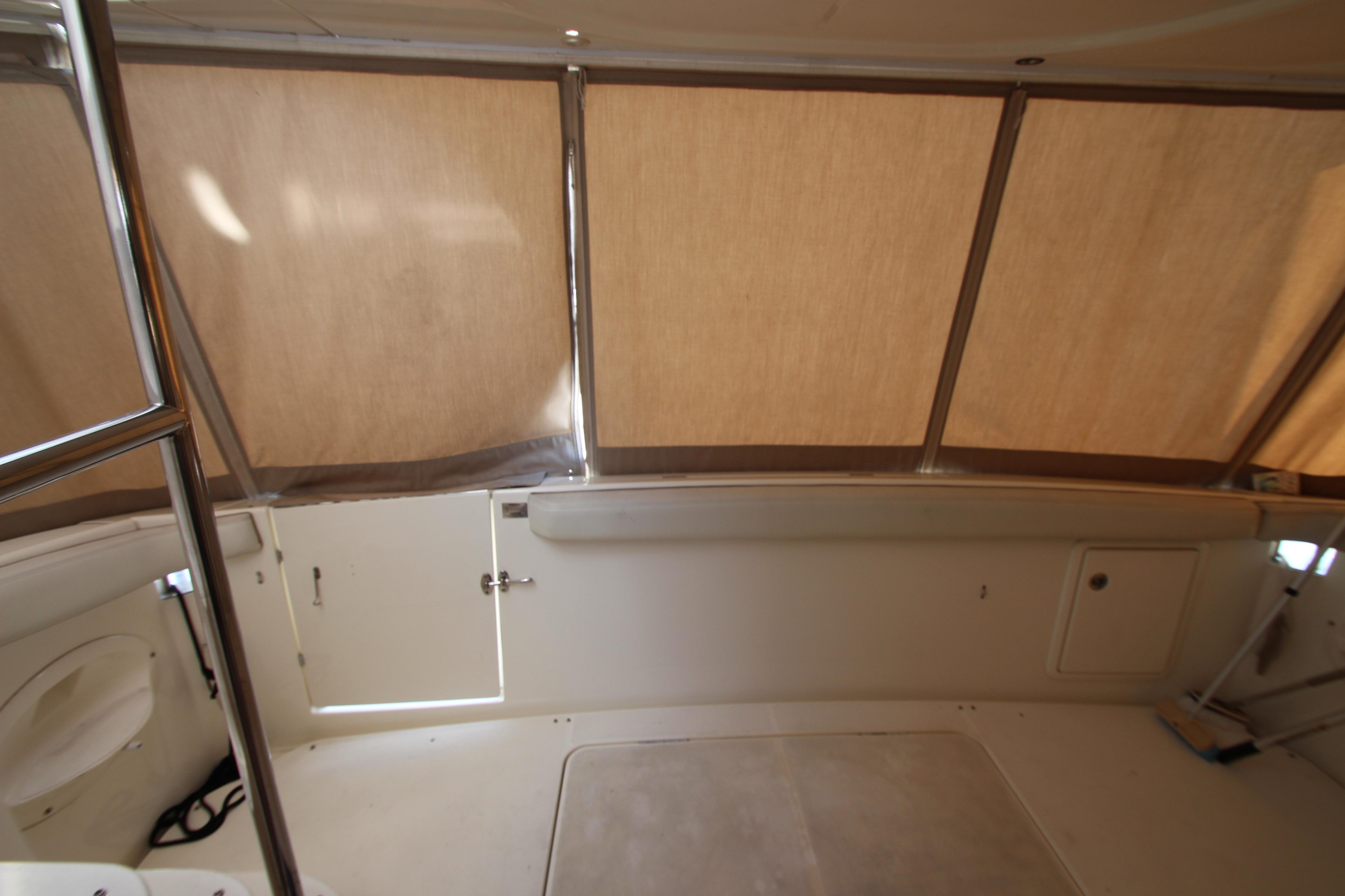 Interior view of a 2006 Silverton 38 Sport Bridge boat with beige canopy.