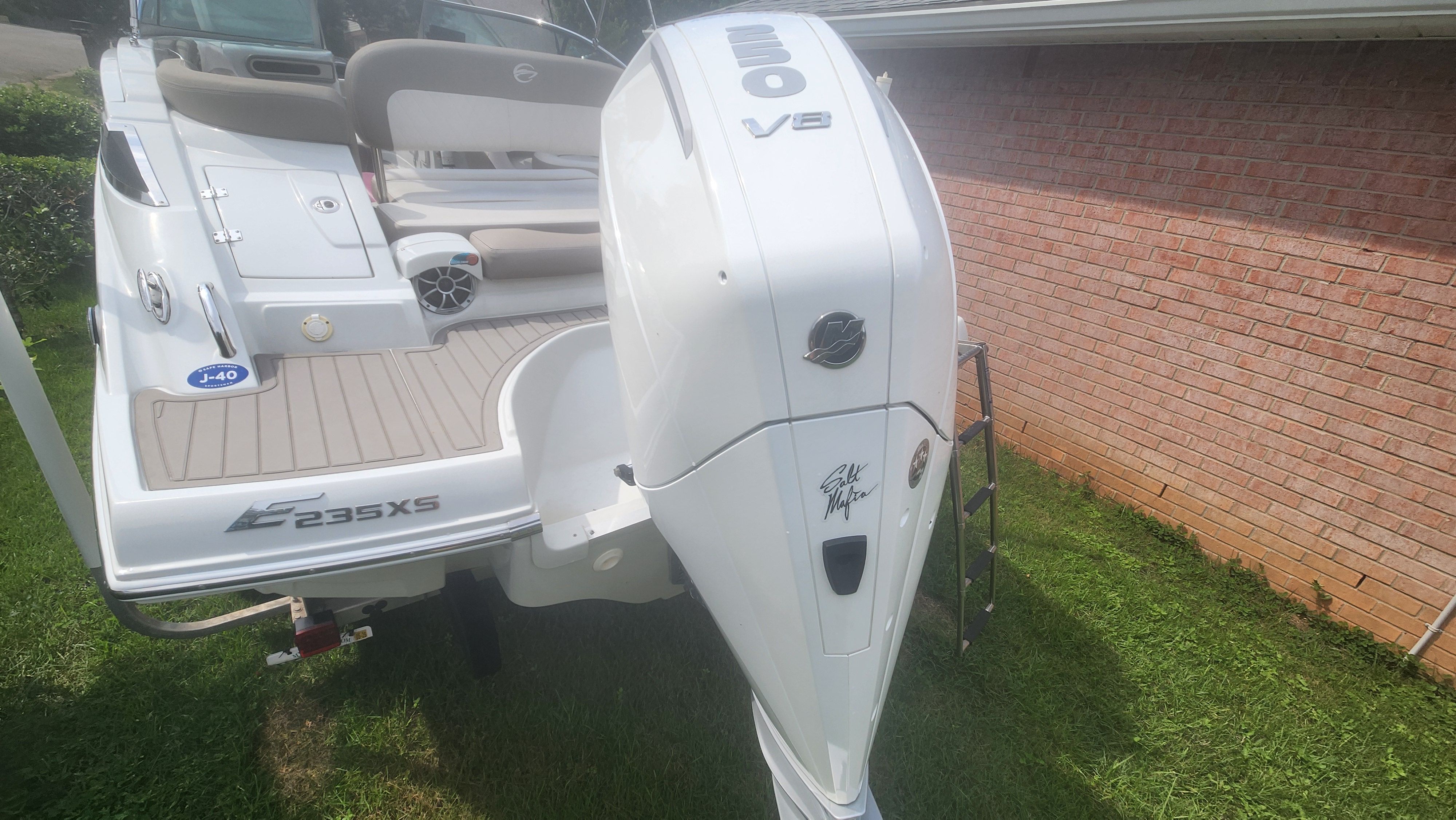 A 2019 Crownline Eclipse E235 XS boat with a large outboard motor.