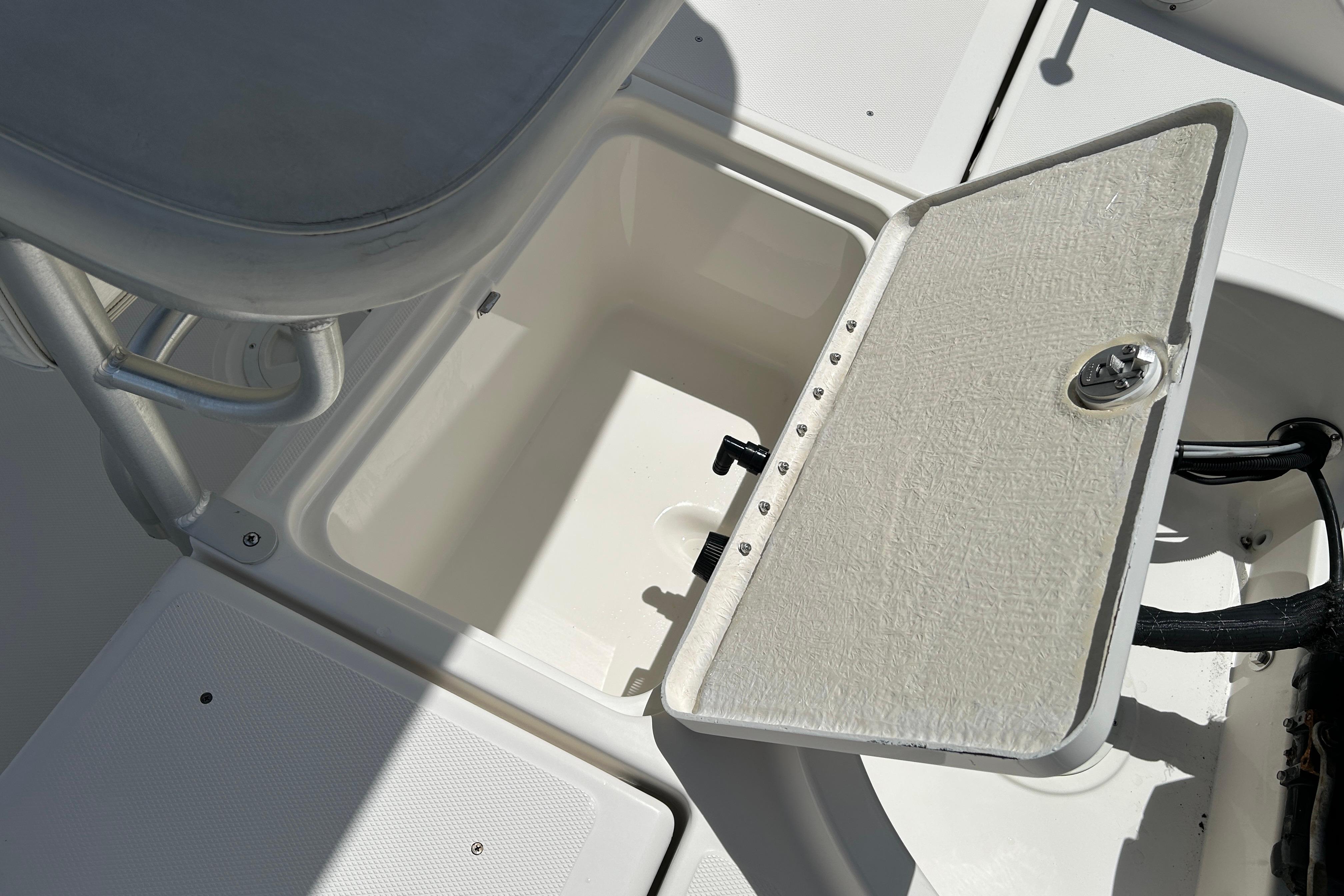 2018 Bayliner Element F16 boat storage compartment with open hatch.