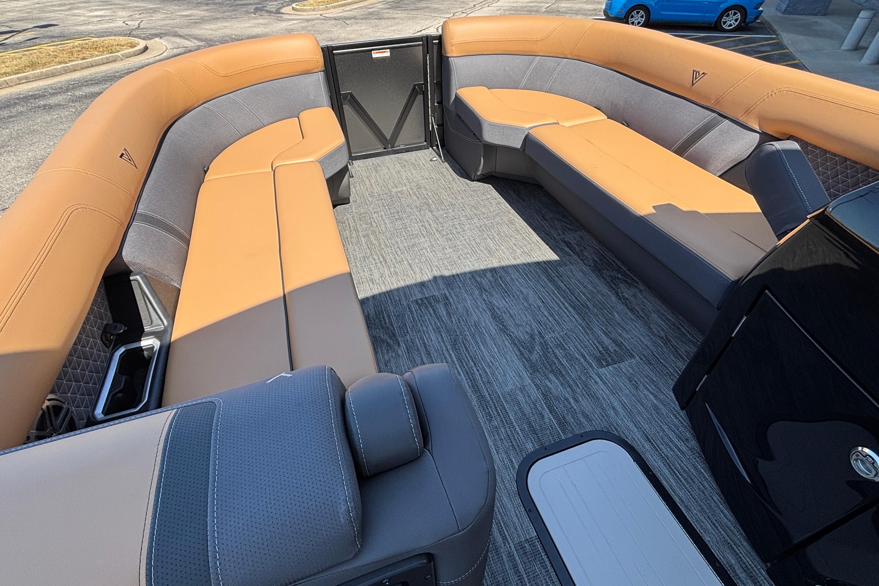 Luxurious interior of 2026 Viaggio Z24U boat with tan and gray seating.