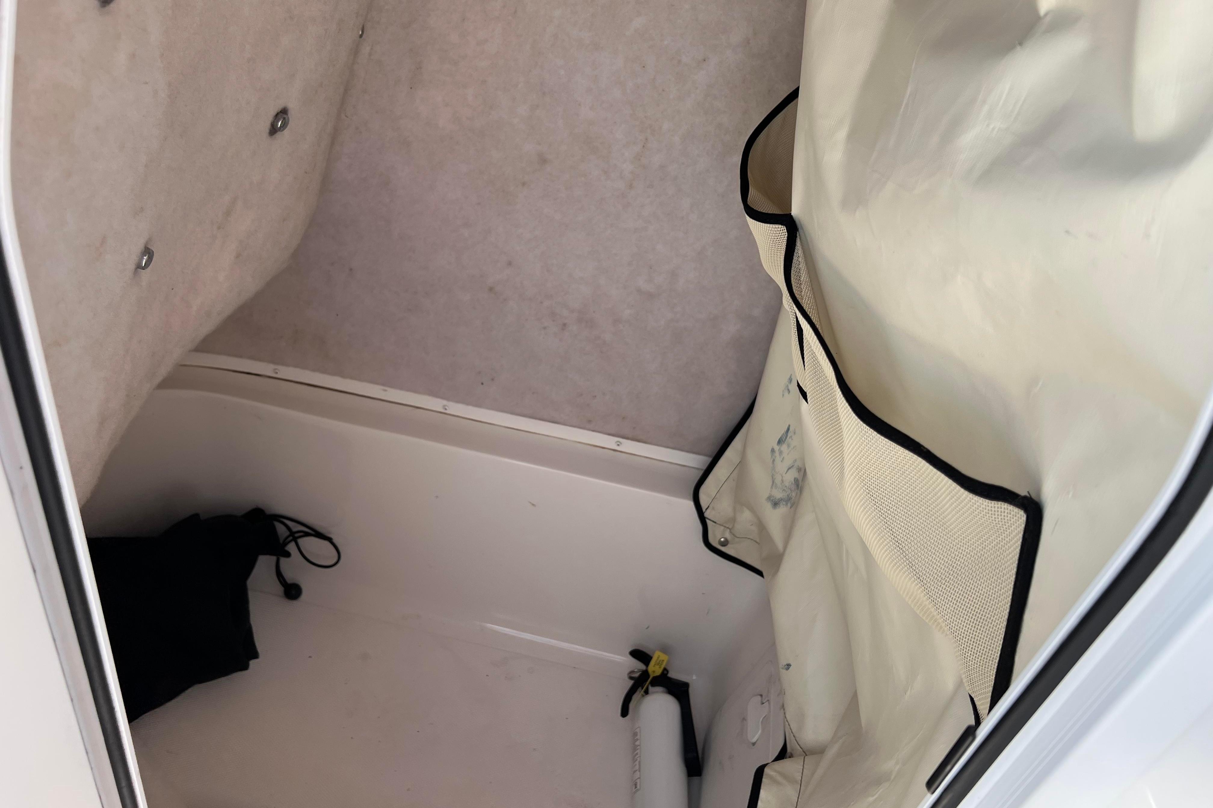 Interior storage compartment of a 2012 Sea Fox 206 Center Console boat.