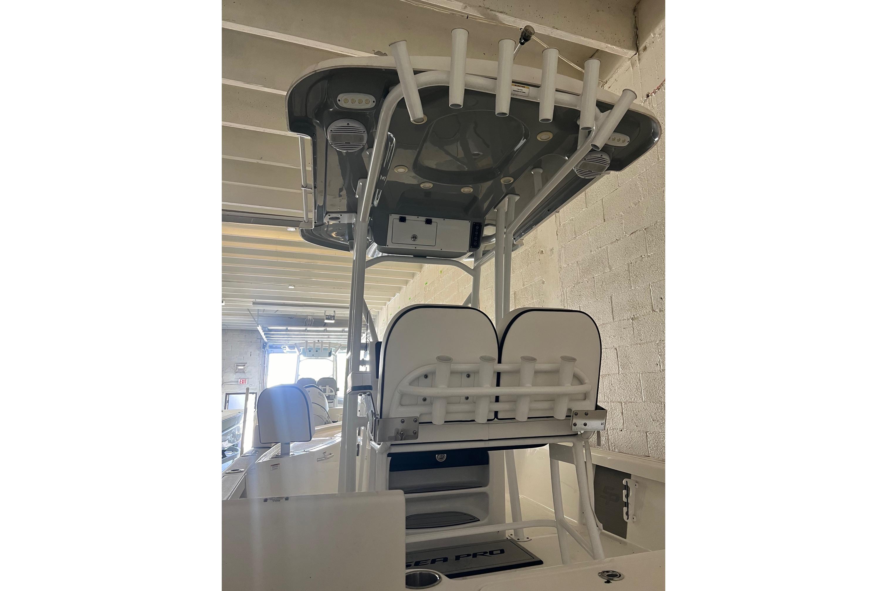 2024 Sea Pro 230 Bay boat interior with seating and rod holders.