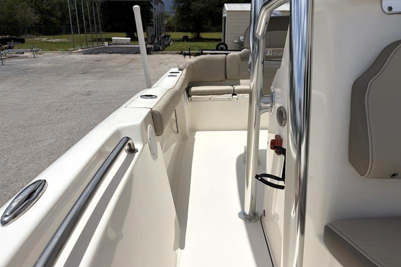 2023 Key West 203 FS boat interior with seating and stainless steel railings.